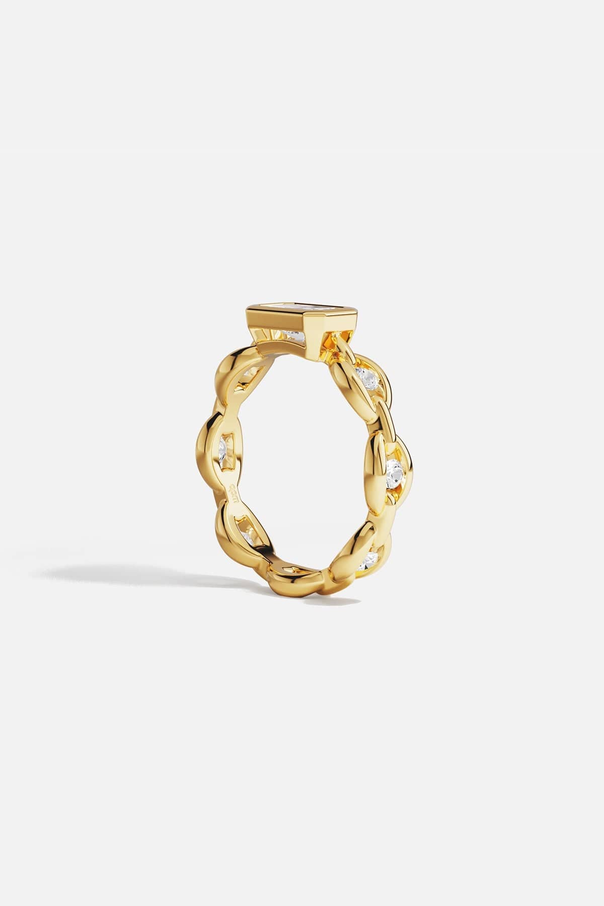 Rings APM Monaco yellow gold chain ring featuring a large rectangular clear stone.