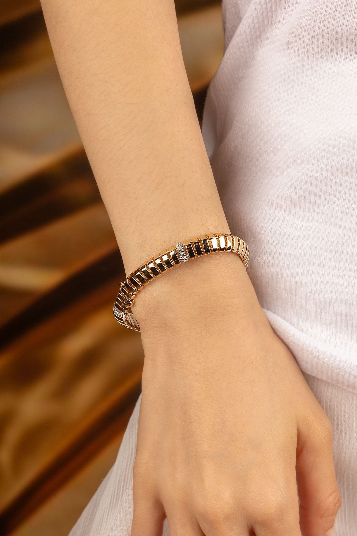 APM Monaco Rayon de Soleil Bracelet in Yellow Gold worn on hand