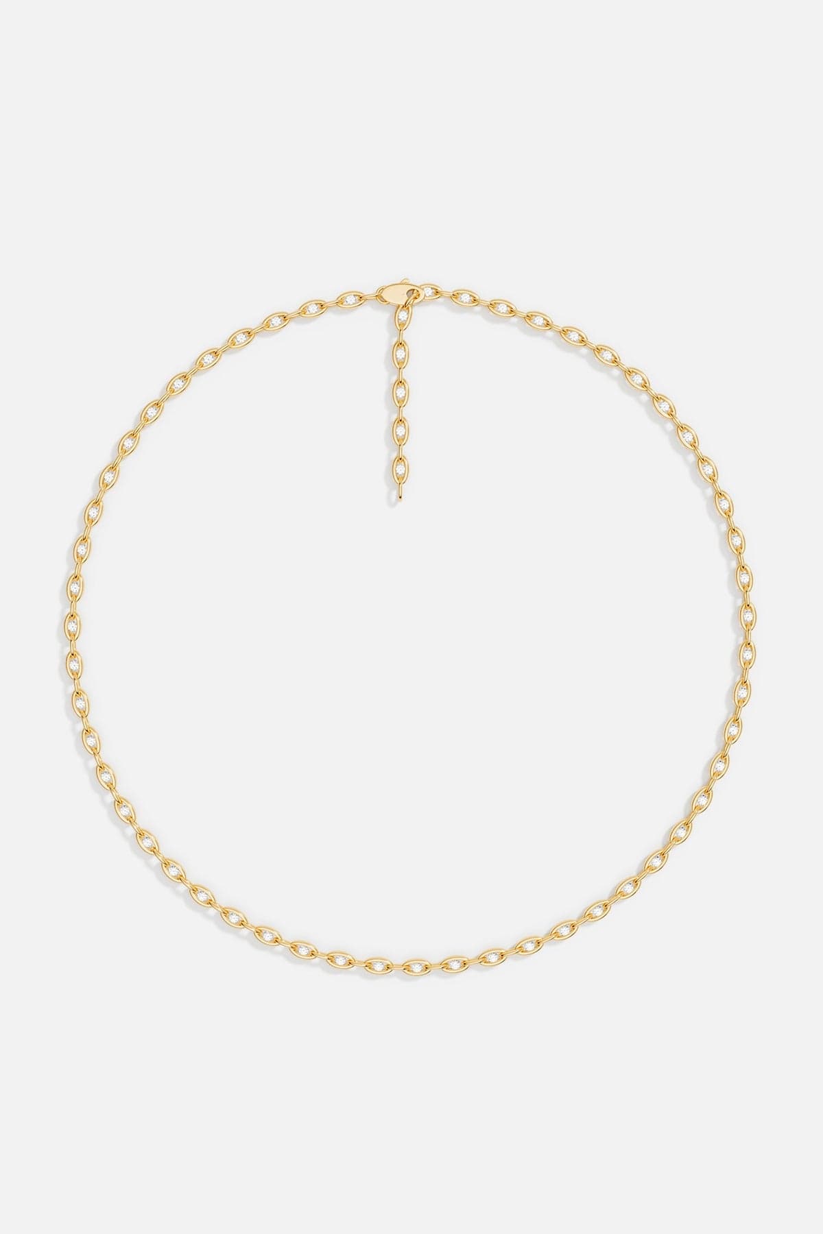 Necklaces APM Monaco. Yellow gold oval pavé chain necklace with small stones.
