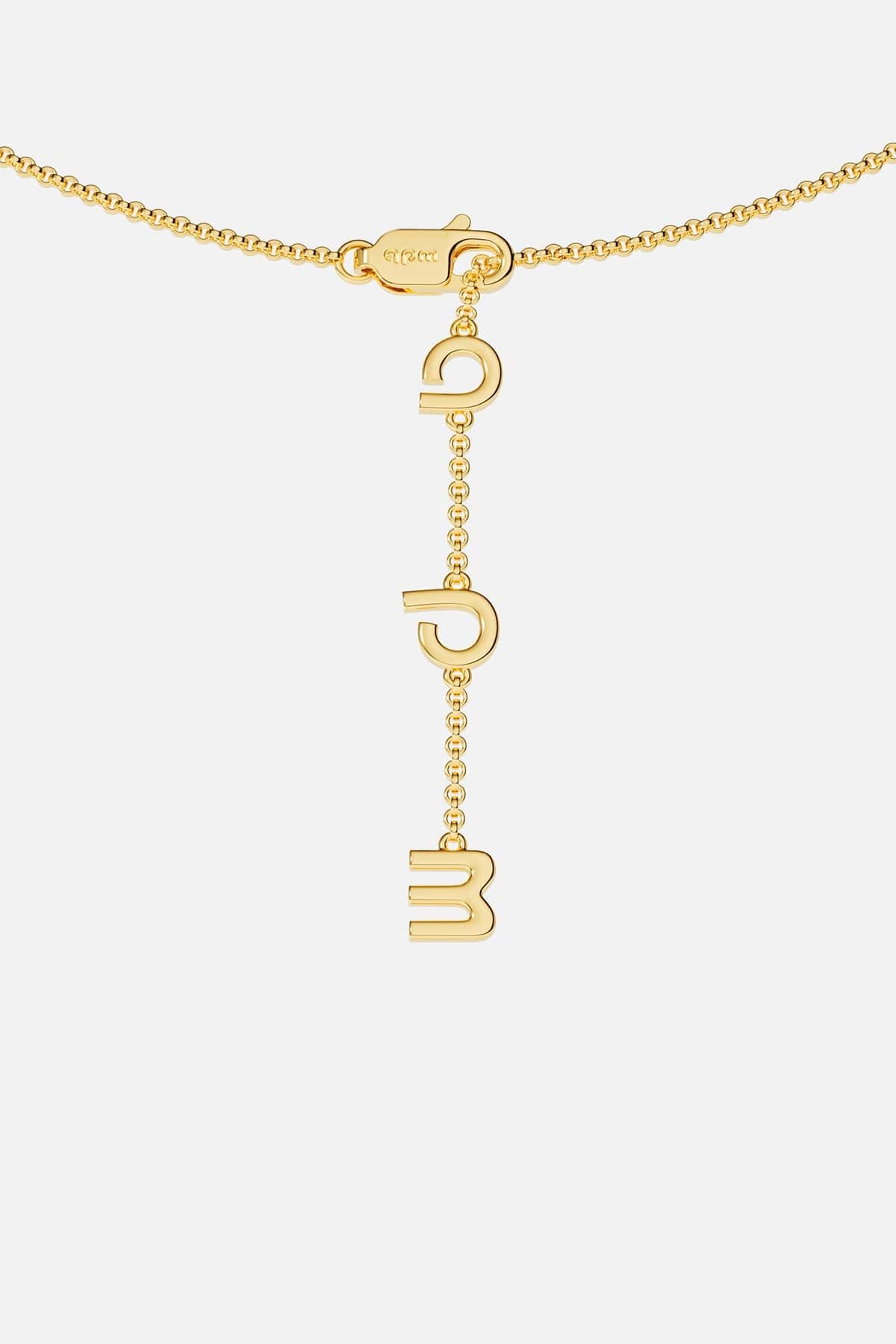 Gold necklace closing on a white background