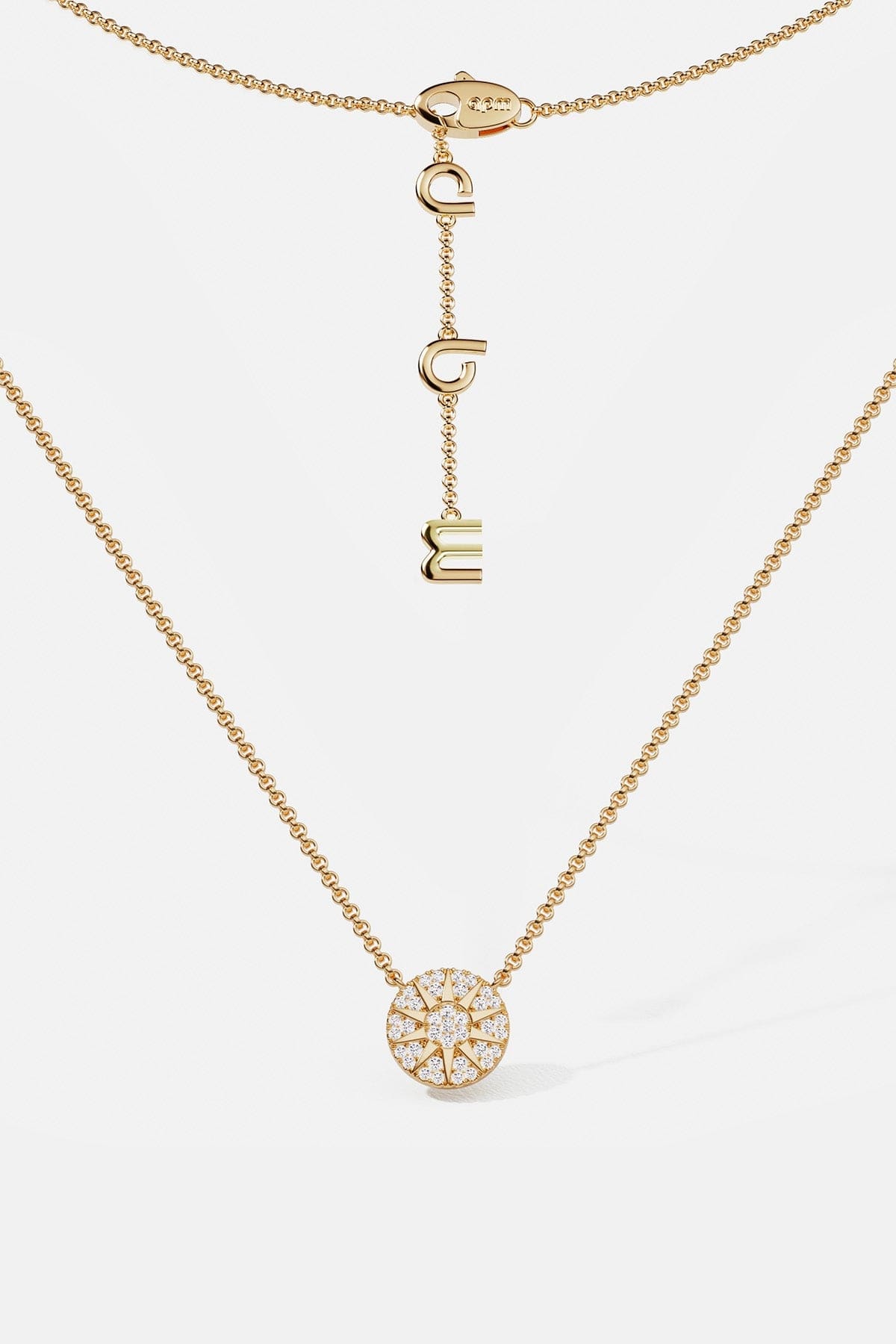 Necklaces APM Monaco: yellow gold chain necklace with a circular white diamond pendant.
