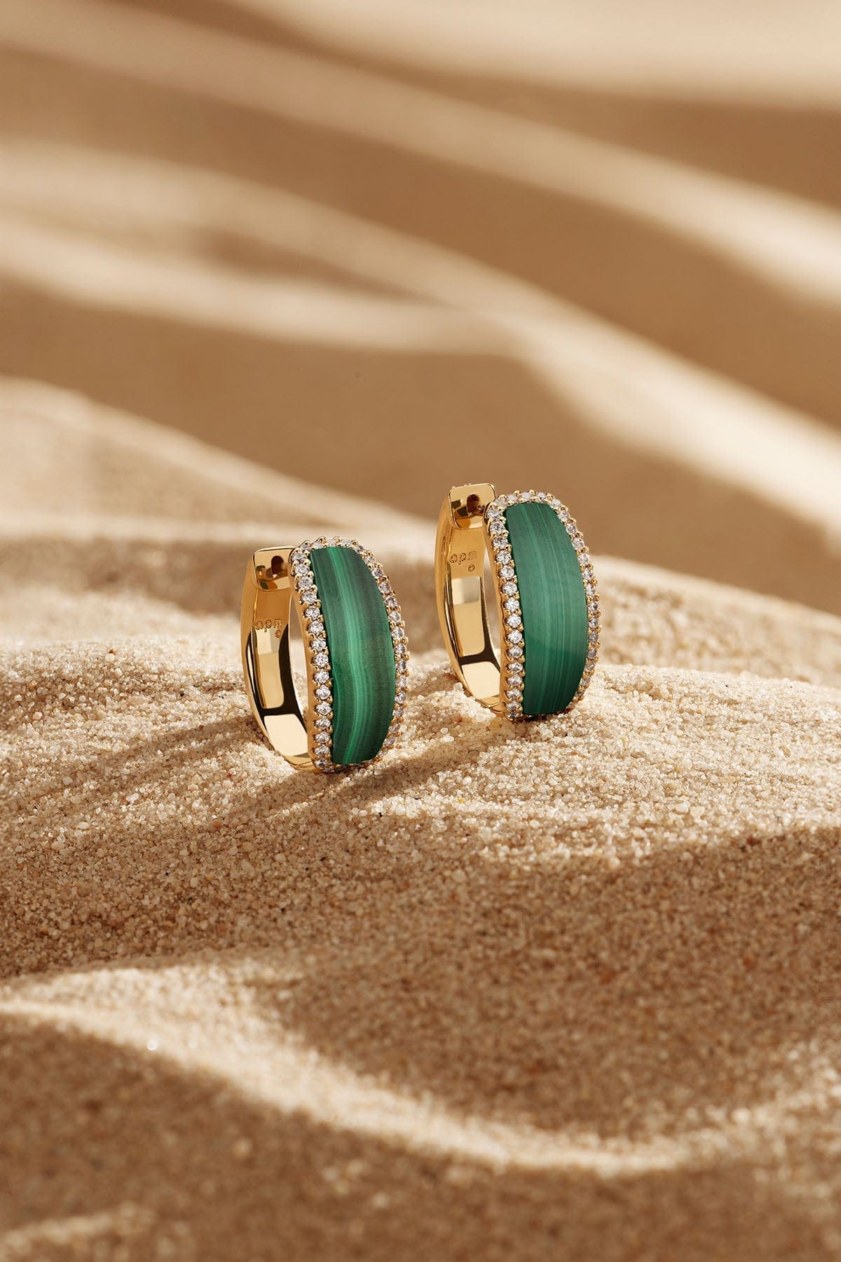 Earrings APM Monaco: yellow gold hoop earrings with malachite-green stones and diamond accents.