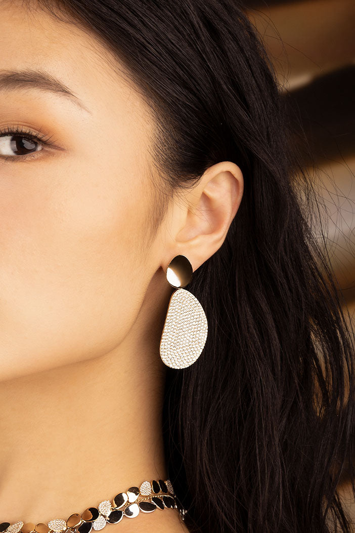 APM Monaco Galet Earrings in Yellow Gold worn on ear