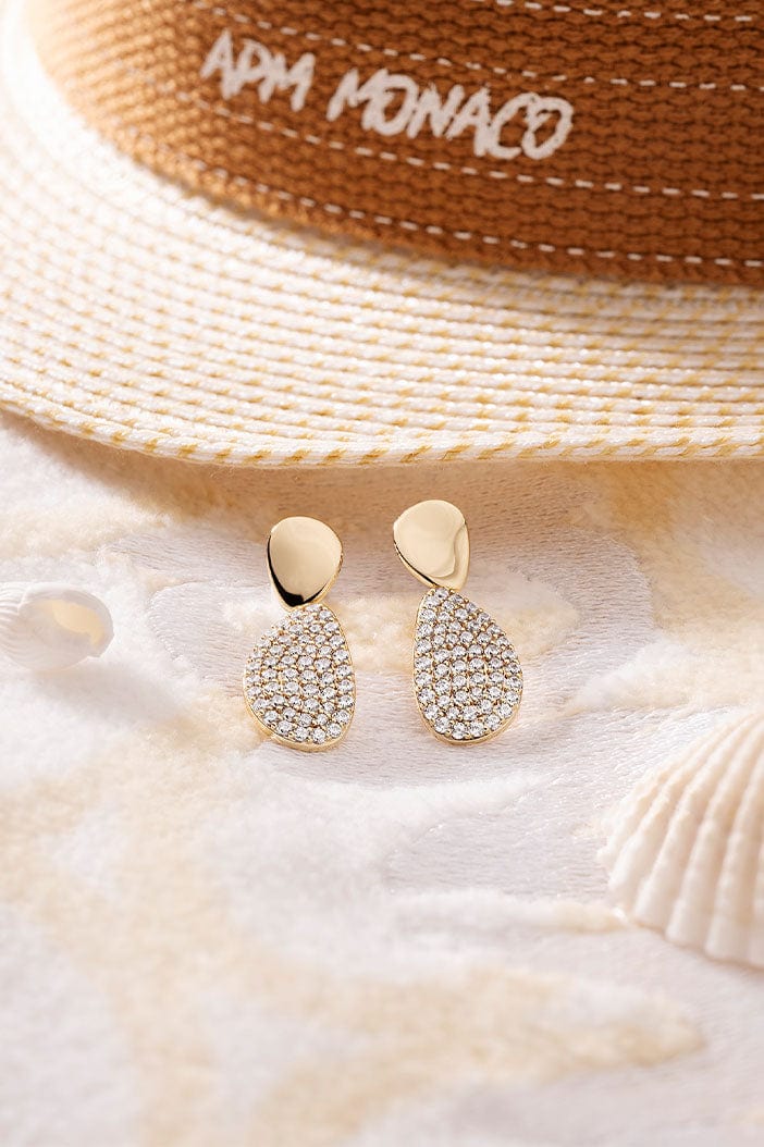 APM Monaco Galet Earrings in Yellow Gold on soft blanket
