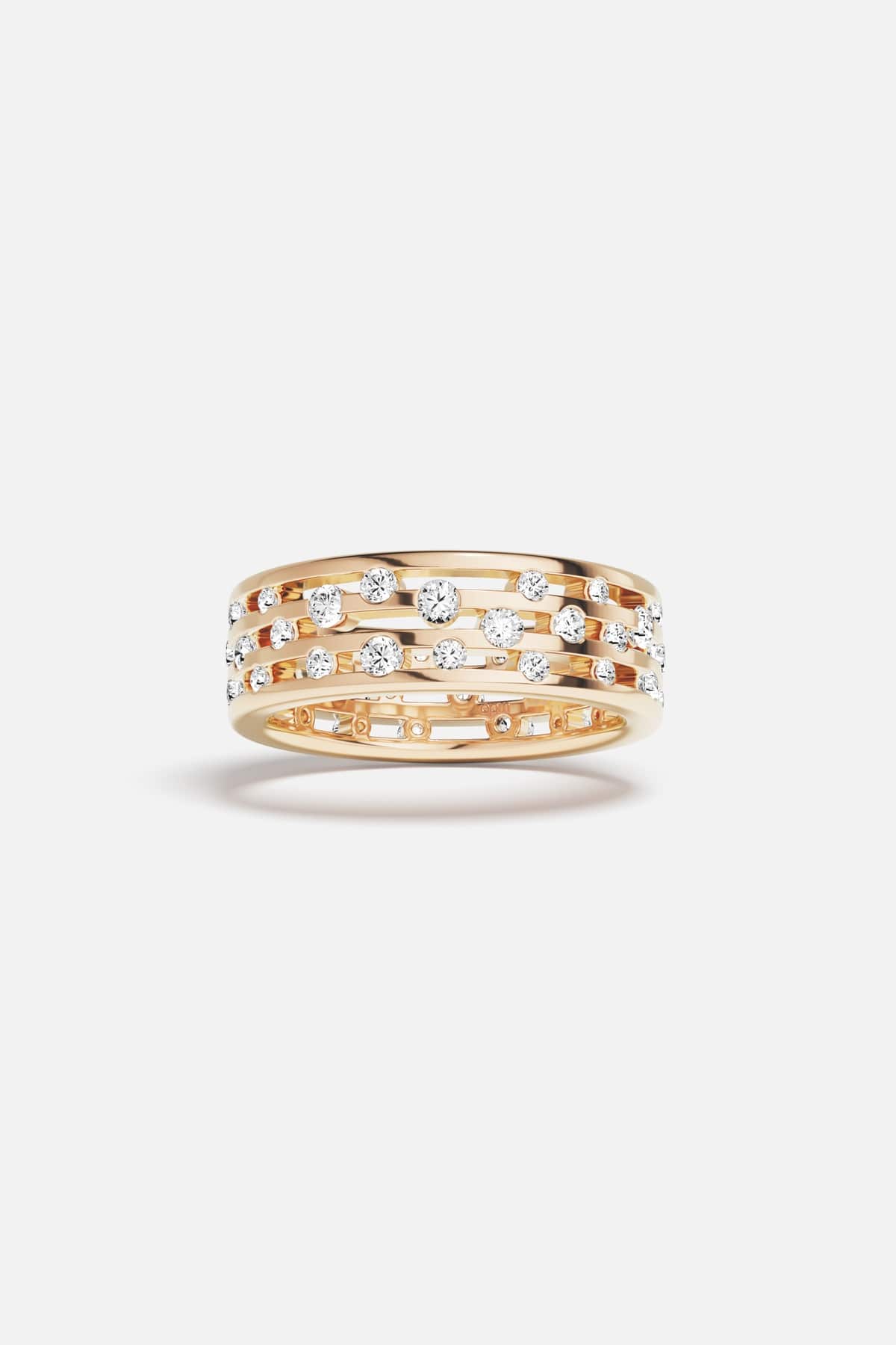 APM Ring in warm gold color, scattered stones dancing with quiet radiance.