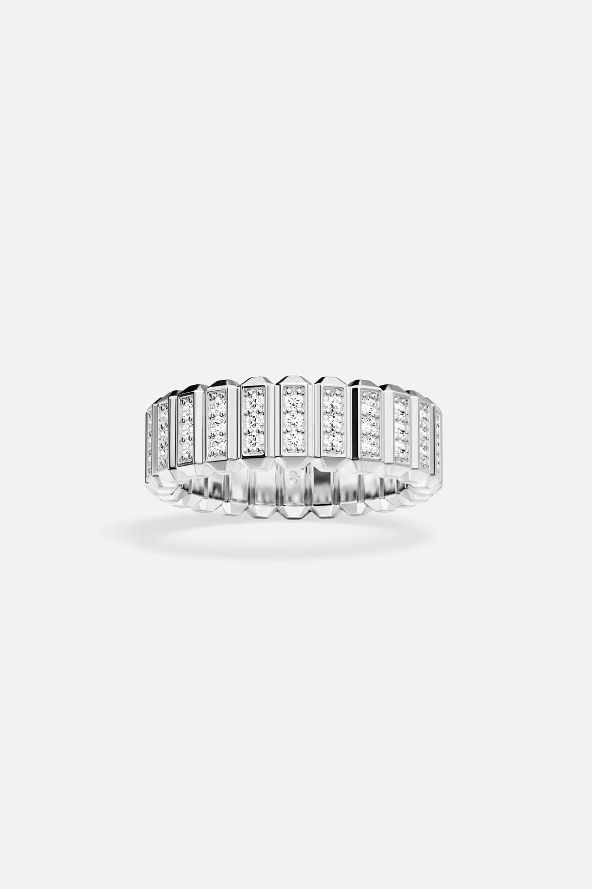 APM ring in rhodium finish, ridged brilliance for a bold modern edge.