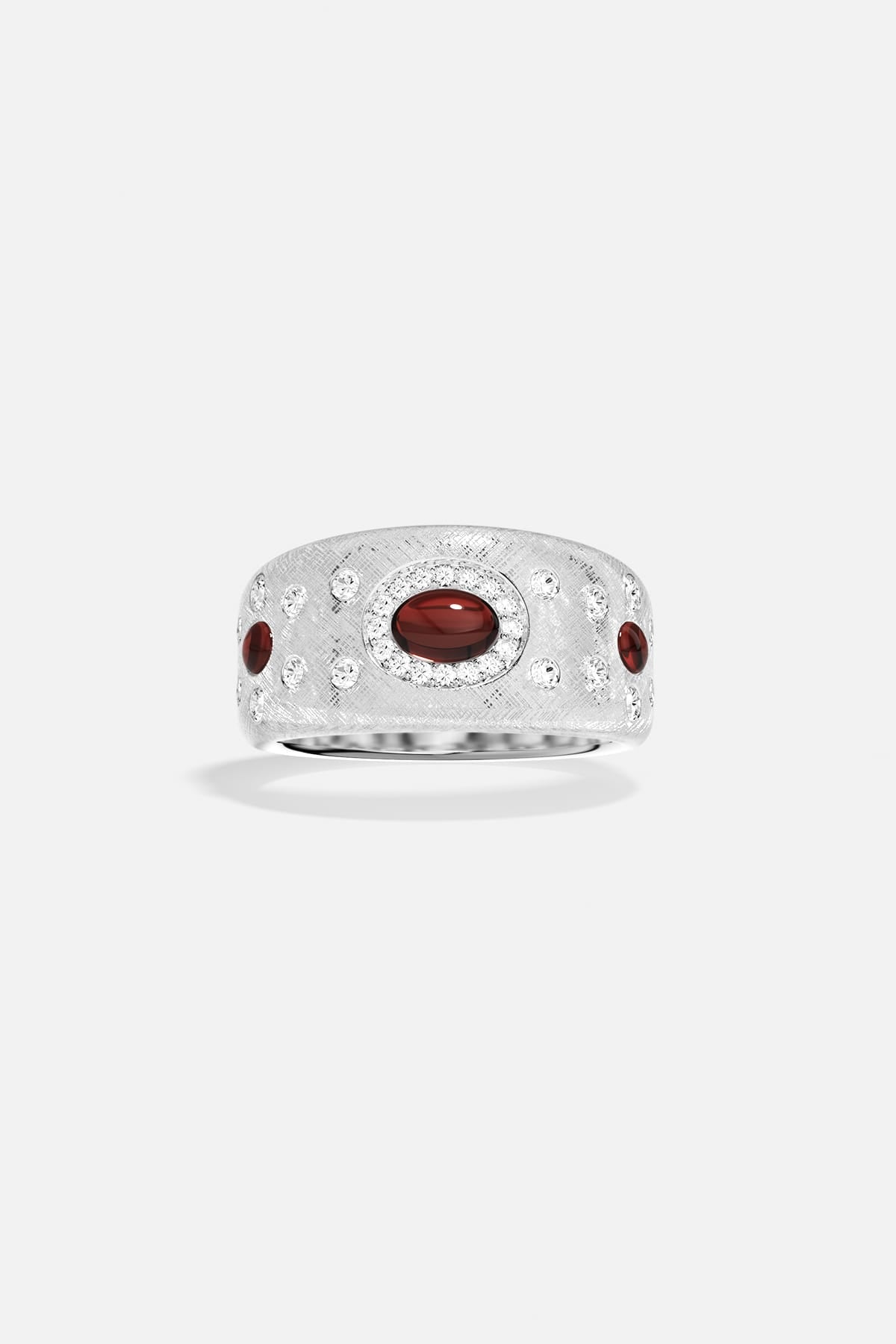APM Monaco ring, brushed rhodium finish glowing with deep red accents, timeless allure.