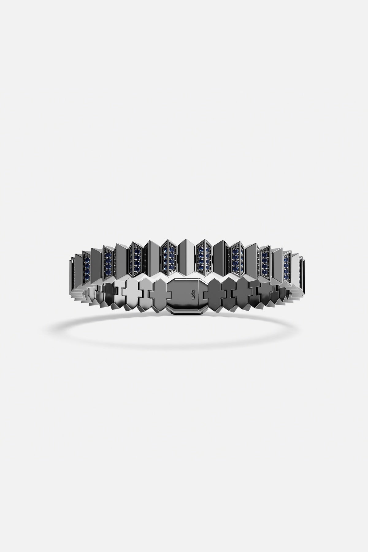 APM Ring in rhodium finish, architectural edge with deep blue accents.