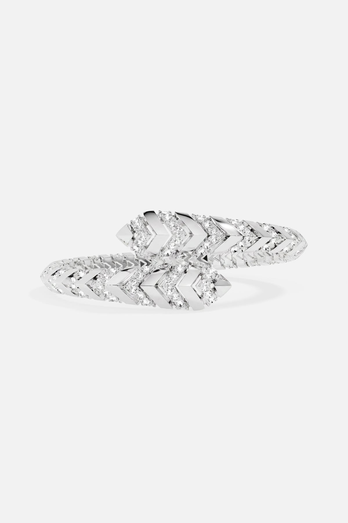 APM Monaco bracelet, a sleek chevron wrap glimmering with modern edge.