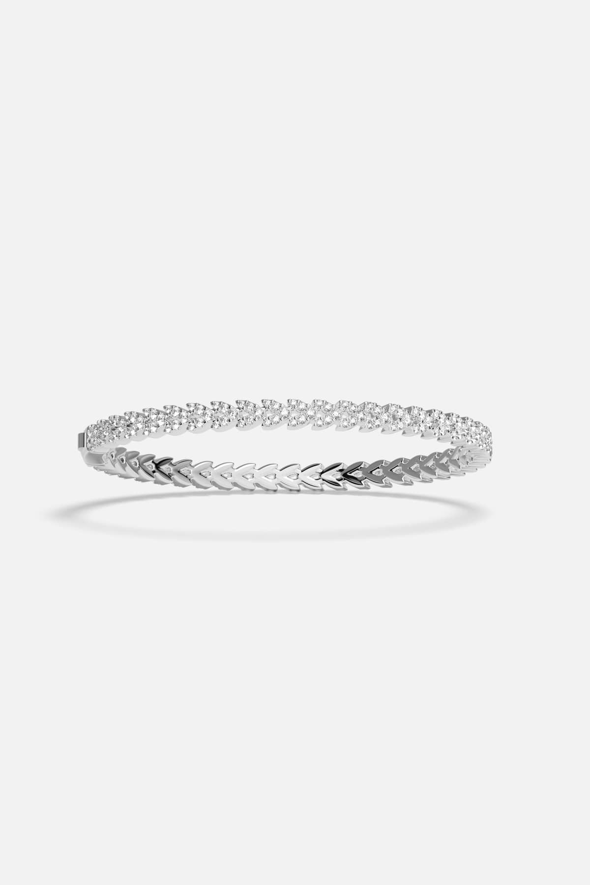 APM Bracelet with a shimmering chevron trail, effortlessly luminous in rhodium finish.
