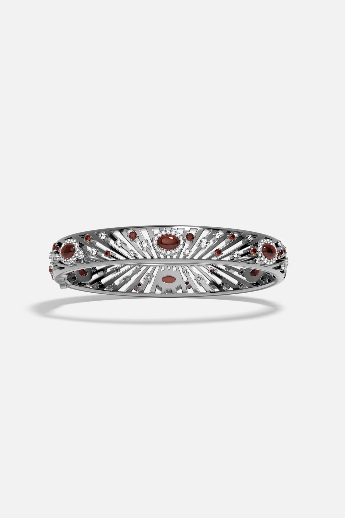 APM Bangle in rhodium finish with radiant red stones, a bold statement of elegance.