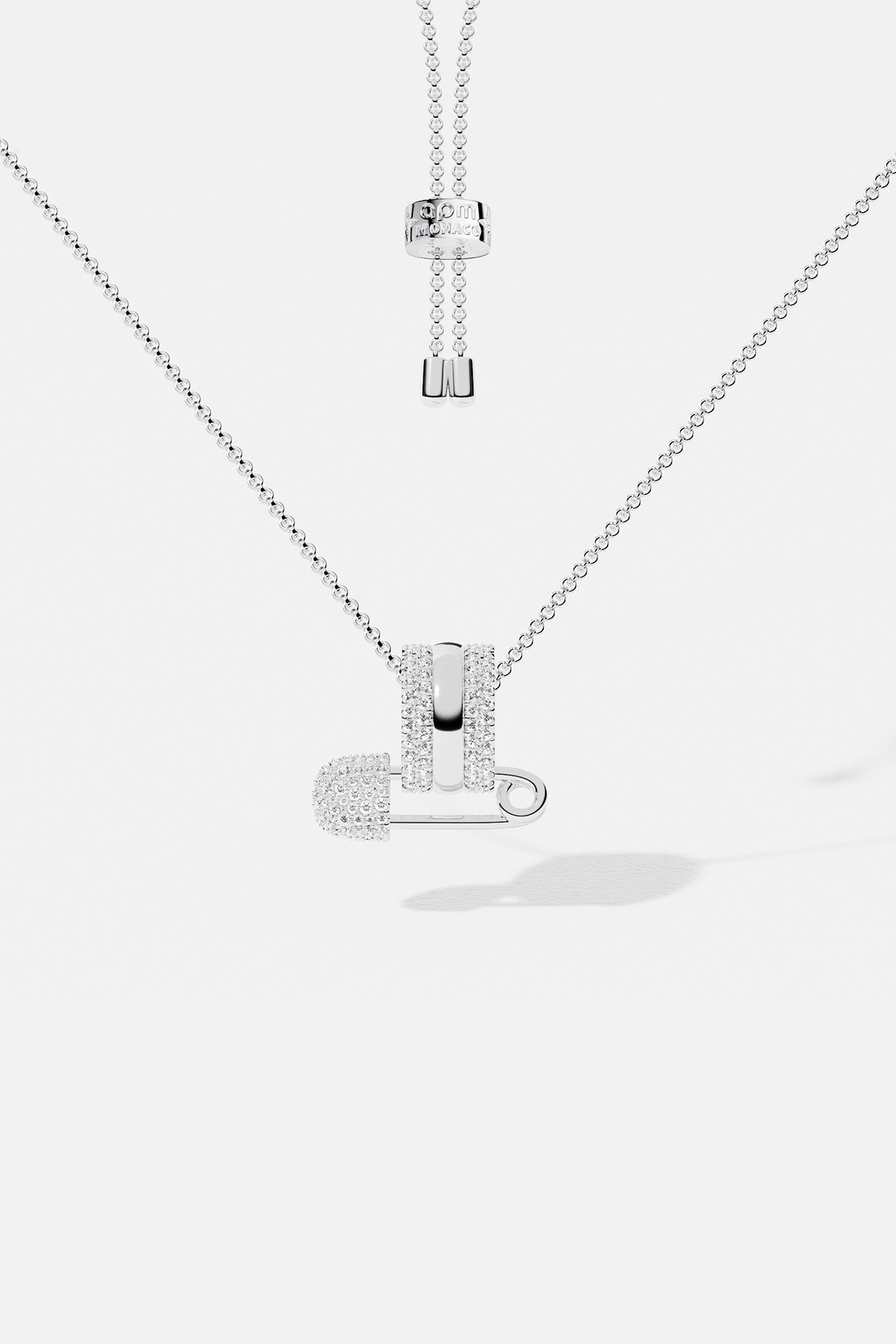 APM Necklace with a playful safety pin pendant, effortlessly cool in rhodium finish.