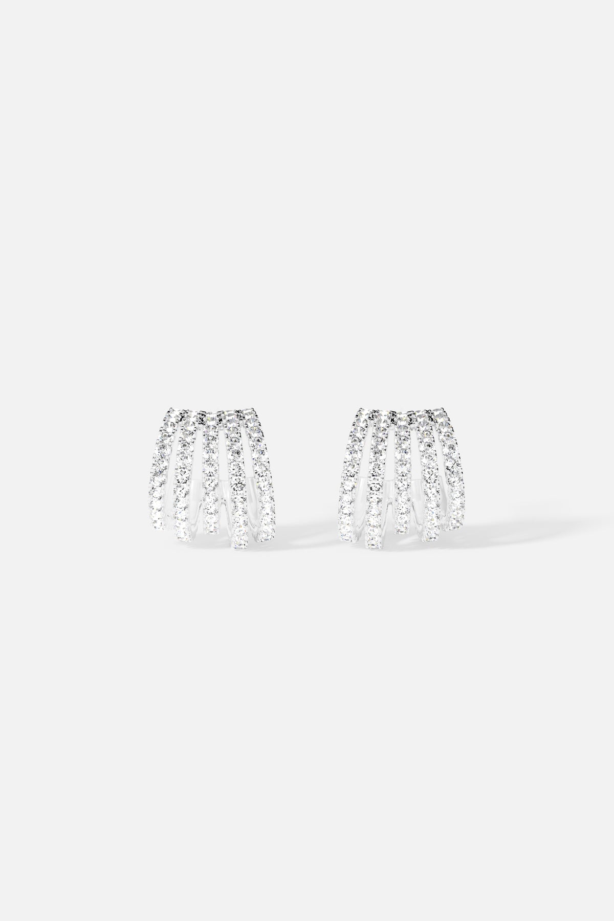 APM Earrings, cascading arcs of shimmer with a modern rhodium finish.