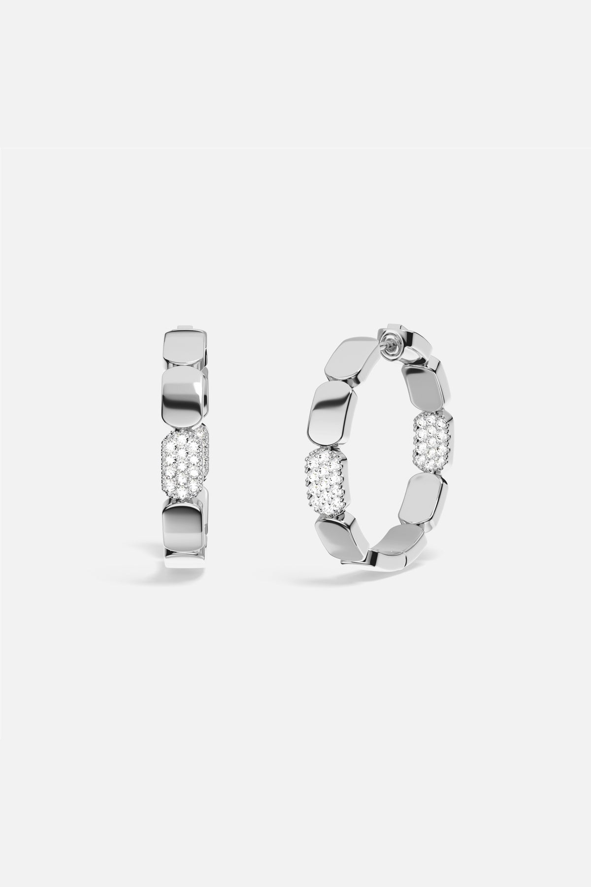 APM Hoop Earrings, a sculptural rhythm with a shimmering pavé statement.