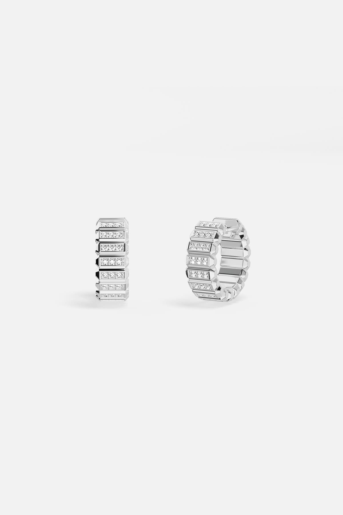 APM Hoop Earrings, architectural shimmer with rhodium finish, effortlessly modern.