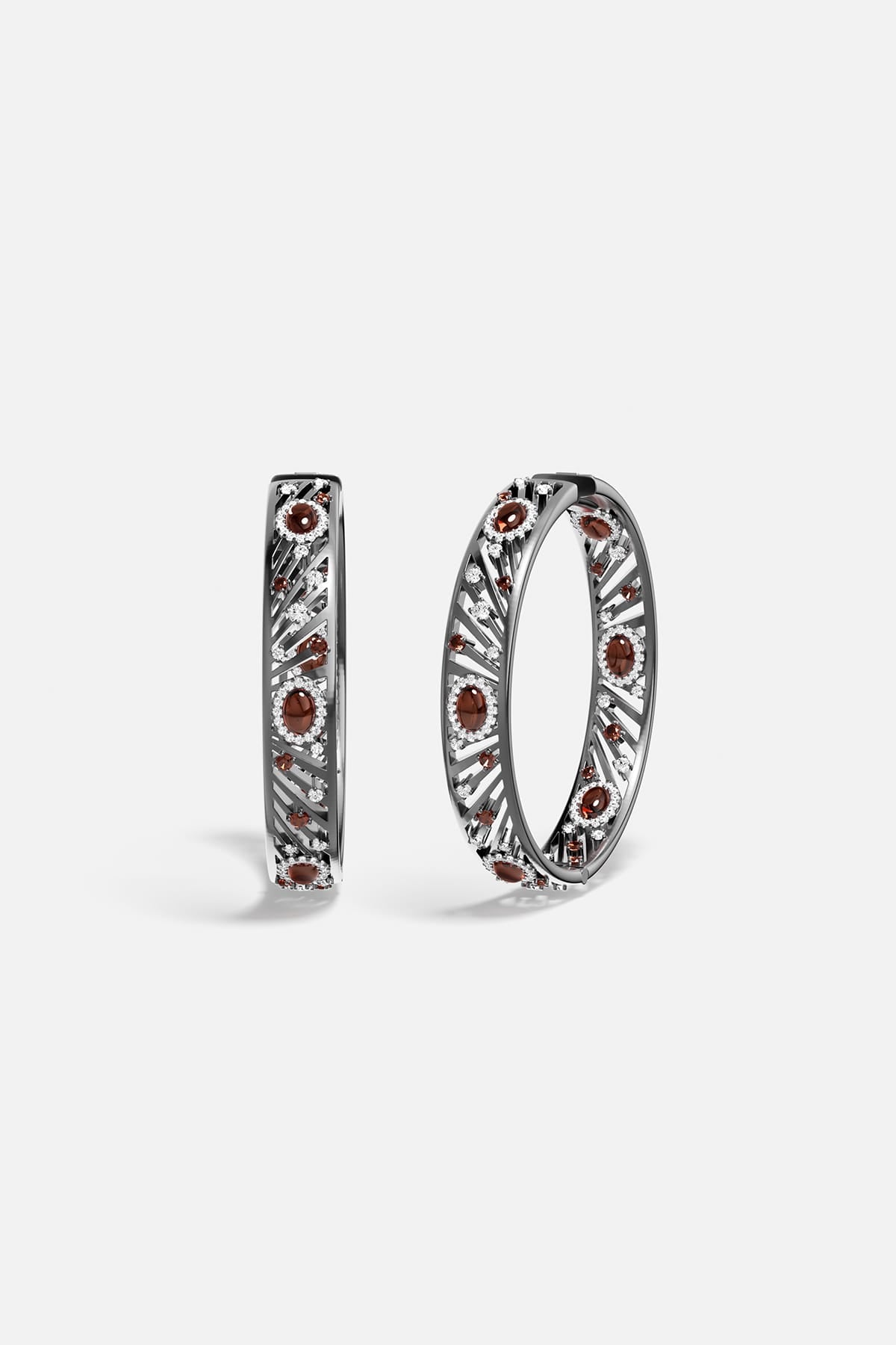 APM Hoop Earrings in rhodium finish, radiant with deep garnet colors and quiet audacity.