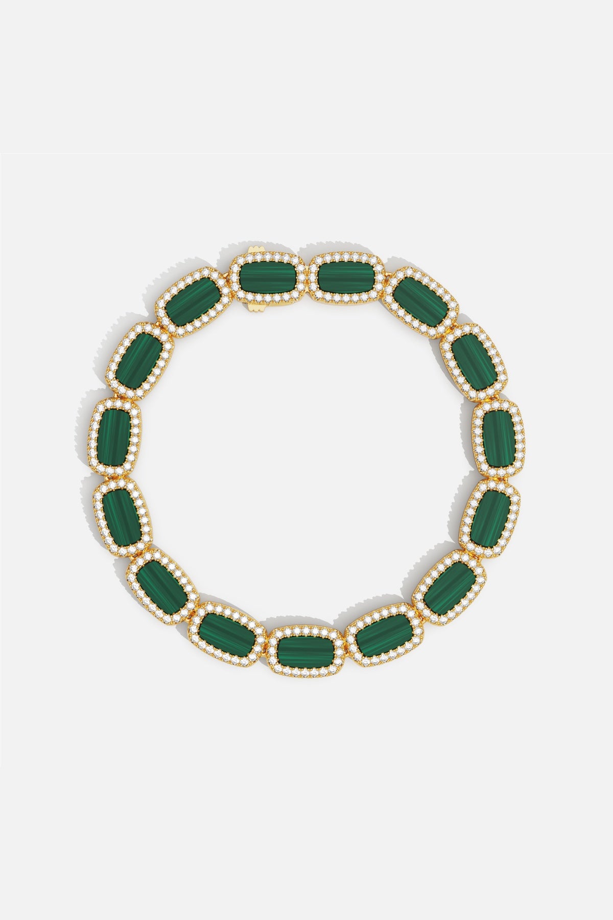 APM Monaco bracelet in golden hues, framing rich green stones with quiet elegance.