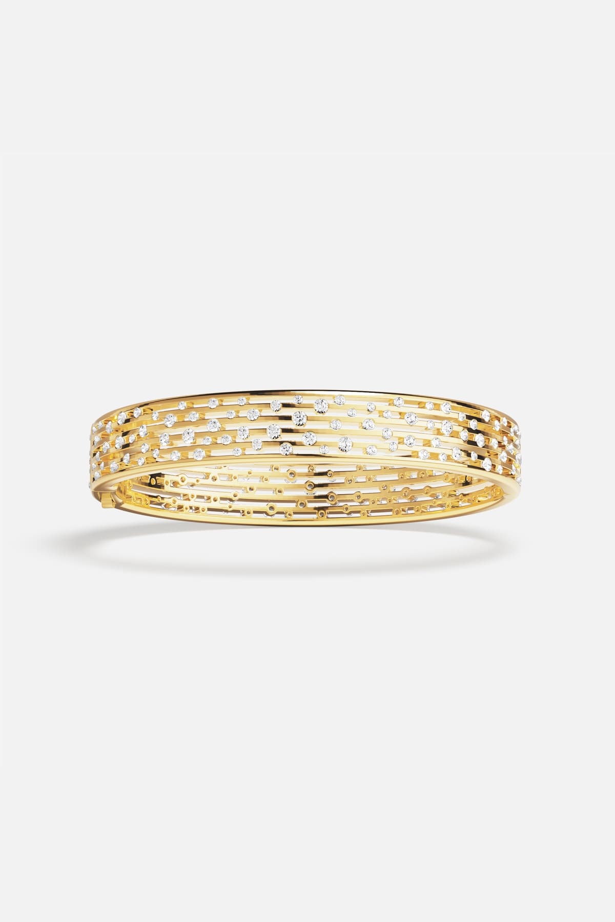 APM Monaco bangle in golden color, scattered sparkles for effortless everyday radiance.