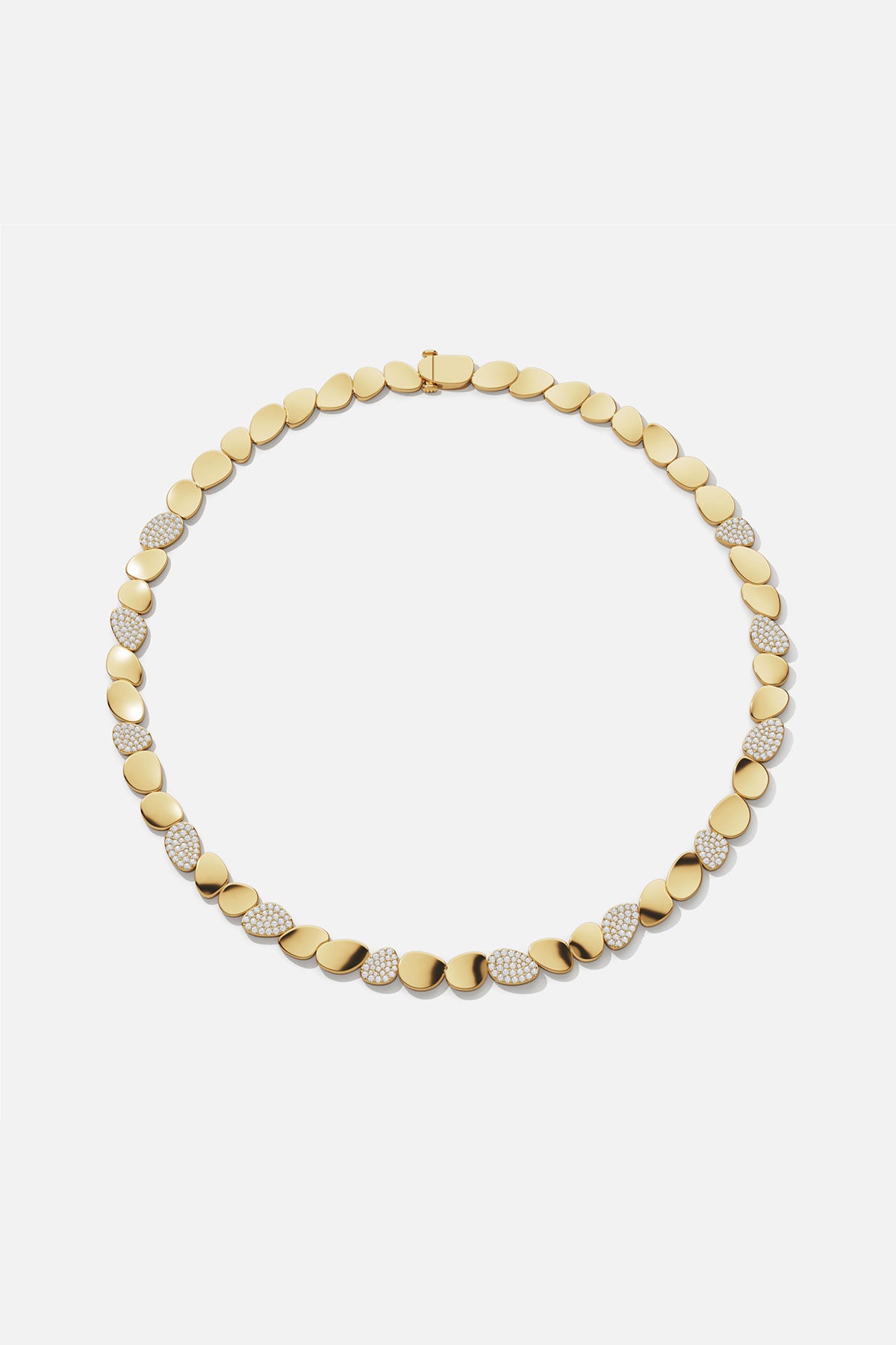 APM Necklace in warm gold color, smooth pebbles glinting with quiet radiance.