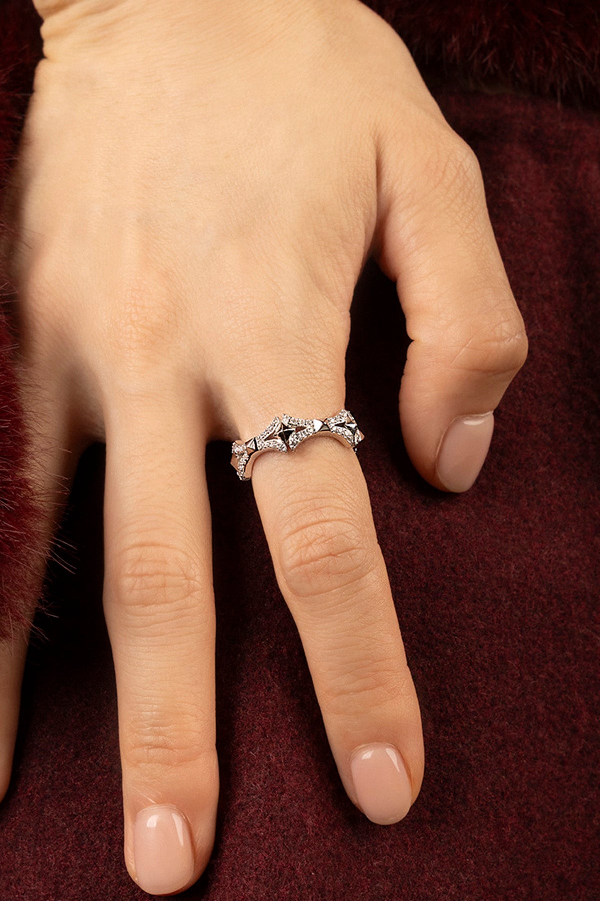 Woman wearing APM Morse Ring, a sparkling whisper of modern elegance.