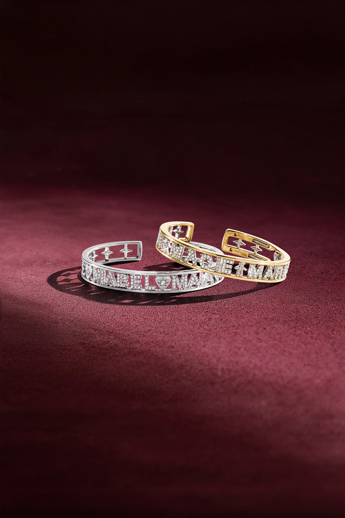 APM Monaco cuff bracelets, sparkling lettered duo in rhodium finish and gold tones.