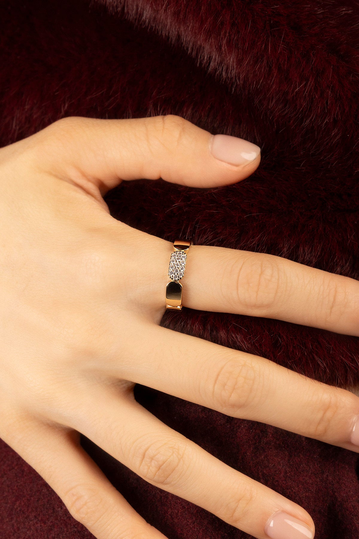 Woman wearing APM Morse Ring, a golden whisper of quiet elegance.