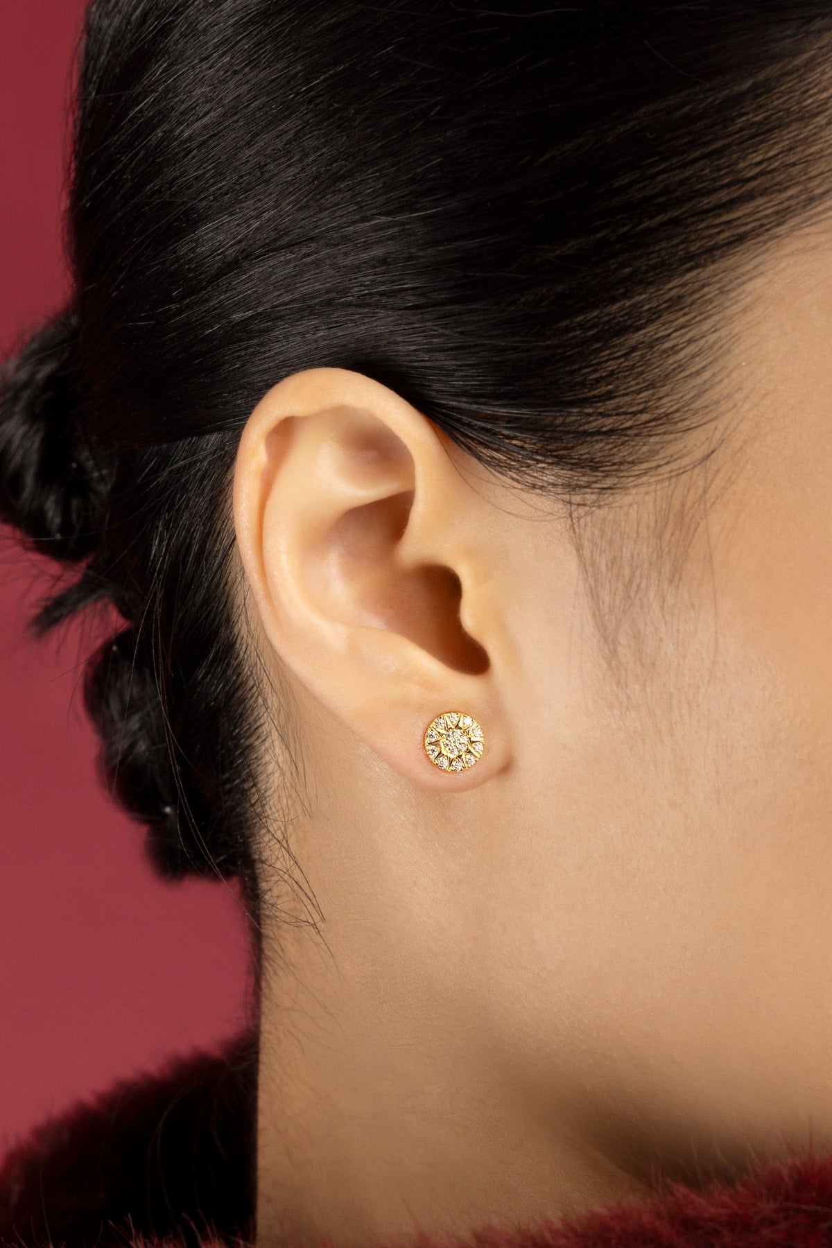 Woman wearing APM Morse Earrings, a radiant whisper of golden elegance.