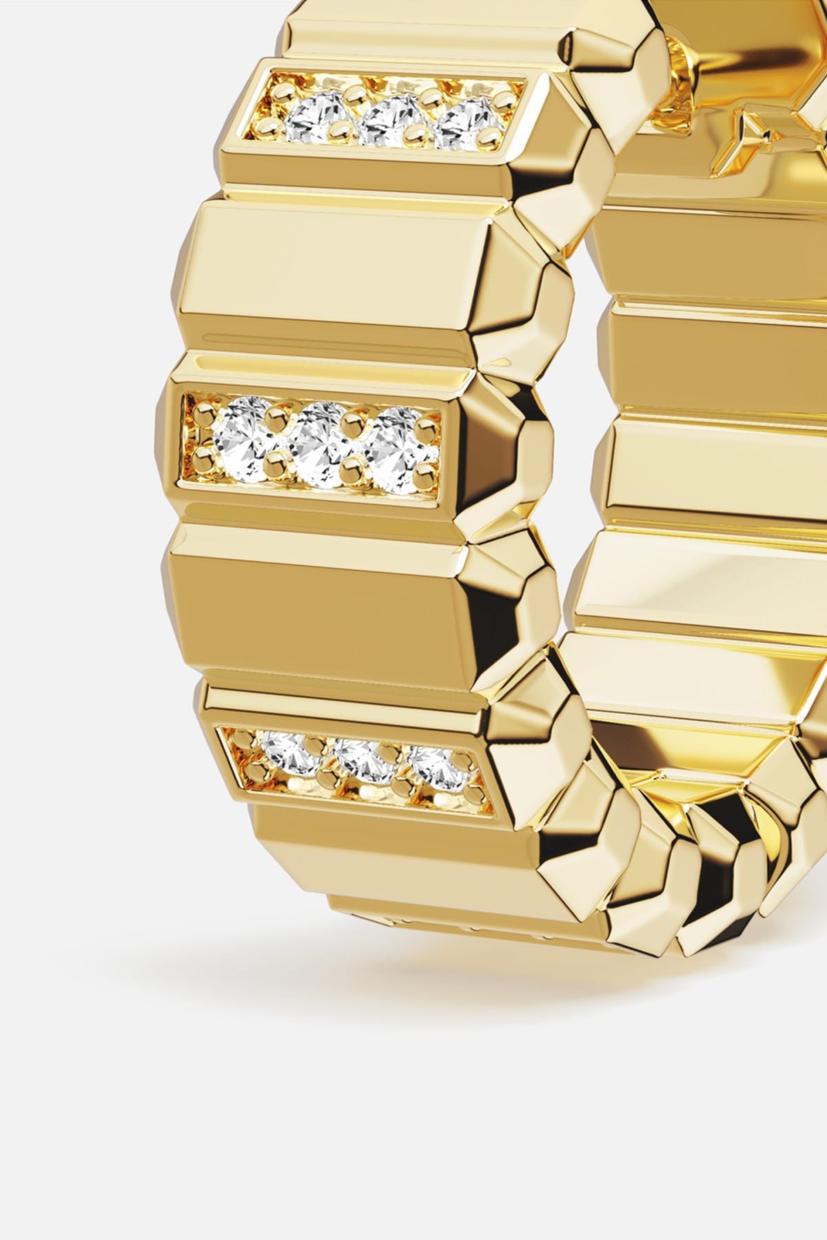 APM Ring in golden color, bold architectural edges with a sparkling whisper of light.