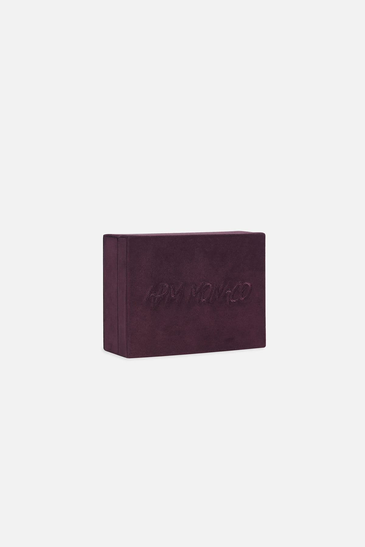APM Monaco velvet jewelry box in deep burgundy, a signature touch of quiet luxury.