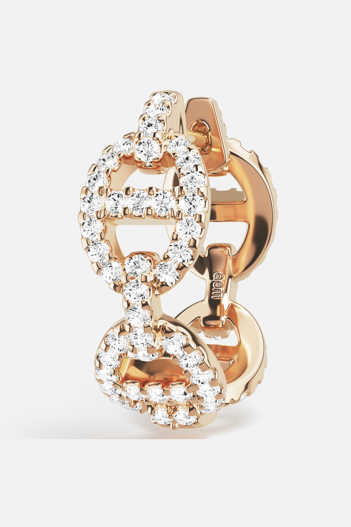 APM Morse Earrings in rhodium finish, linked brilliance with a golden glow.