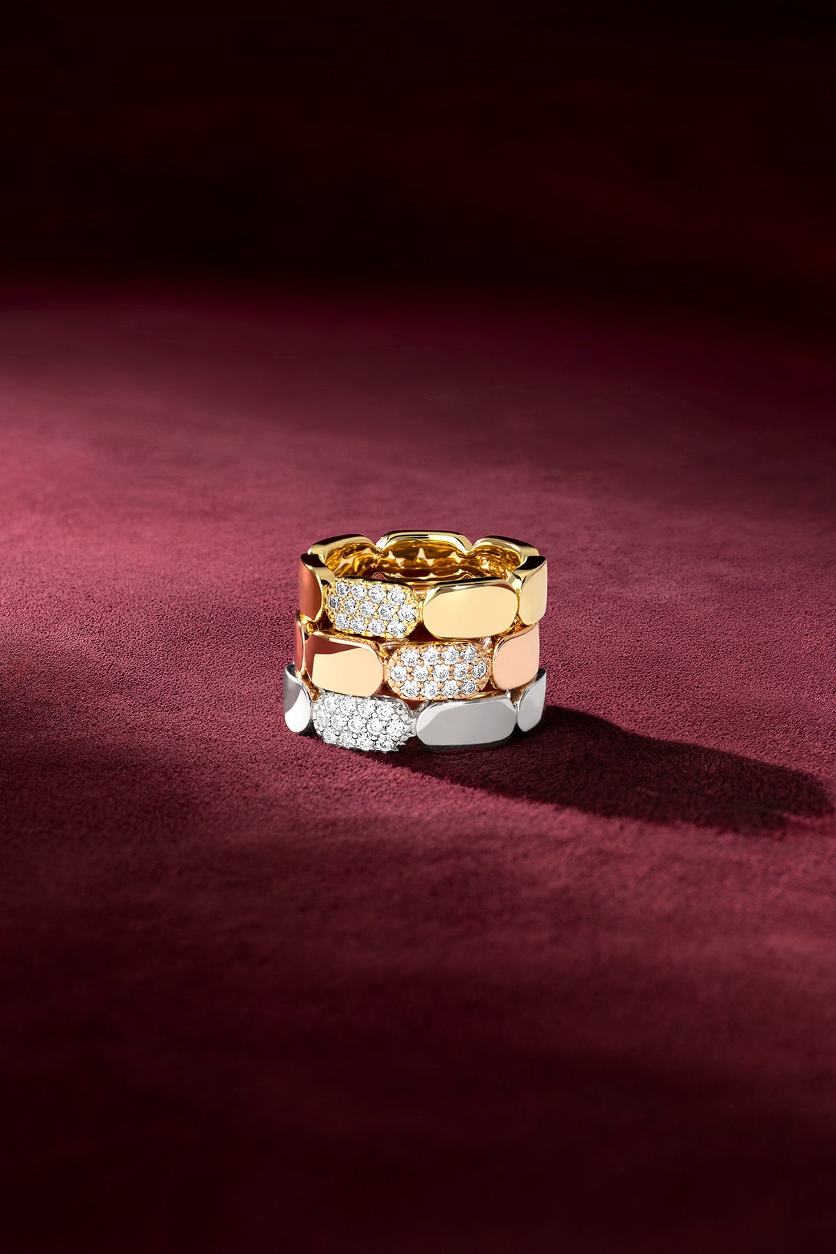 APM Rings stacked in three colors, a bold and radiant statement.