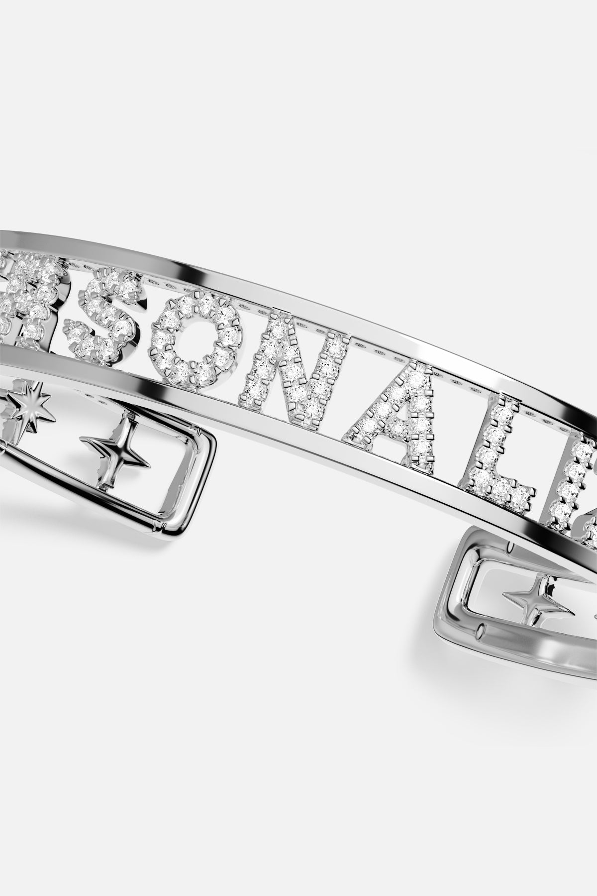 APM personalized cuff bracelet in rhodium finish, shimmering letters for a signature statement.