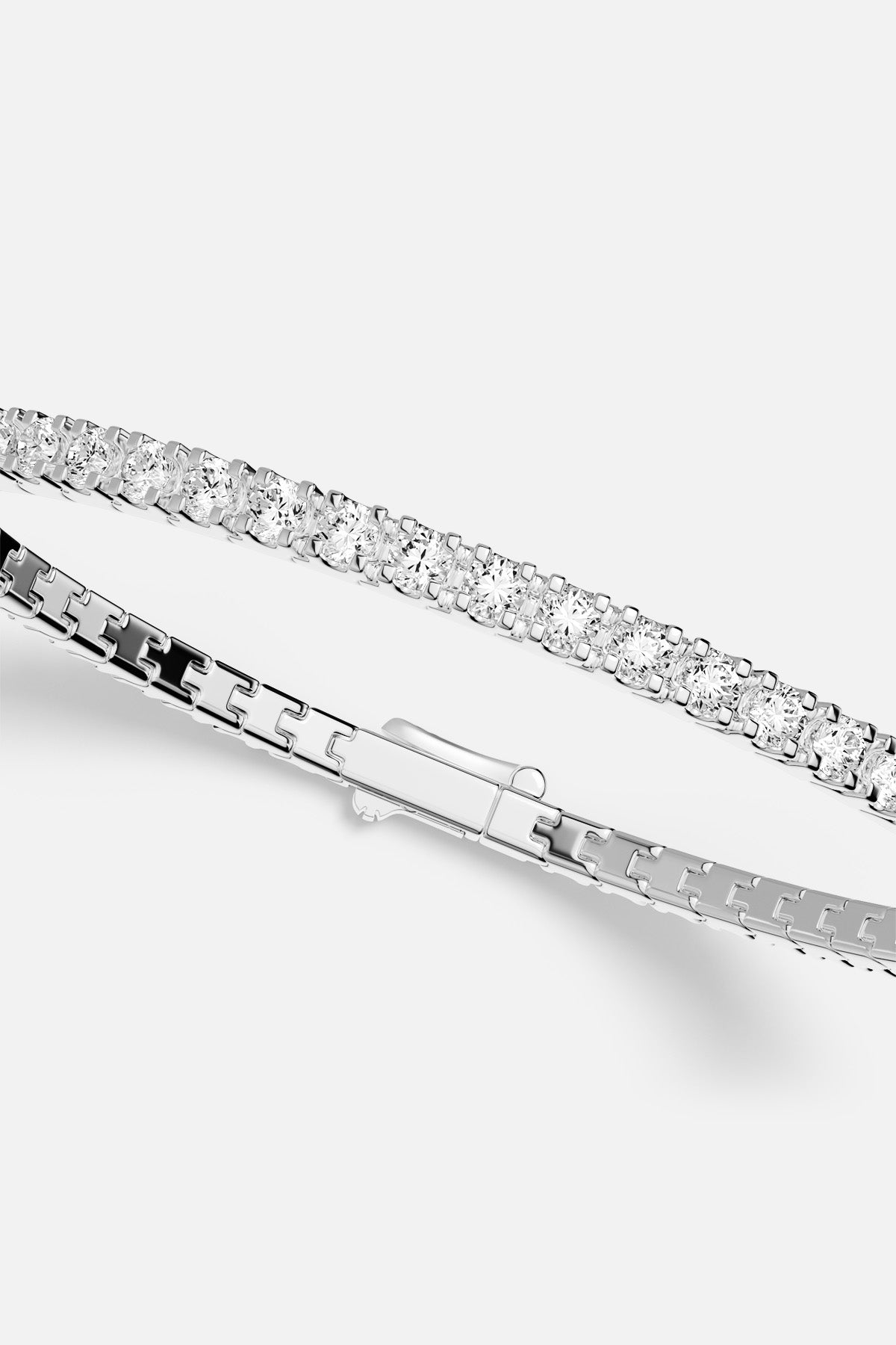 APM Tennis Bracelet, a luminous line of brilliance in rhodium finish.