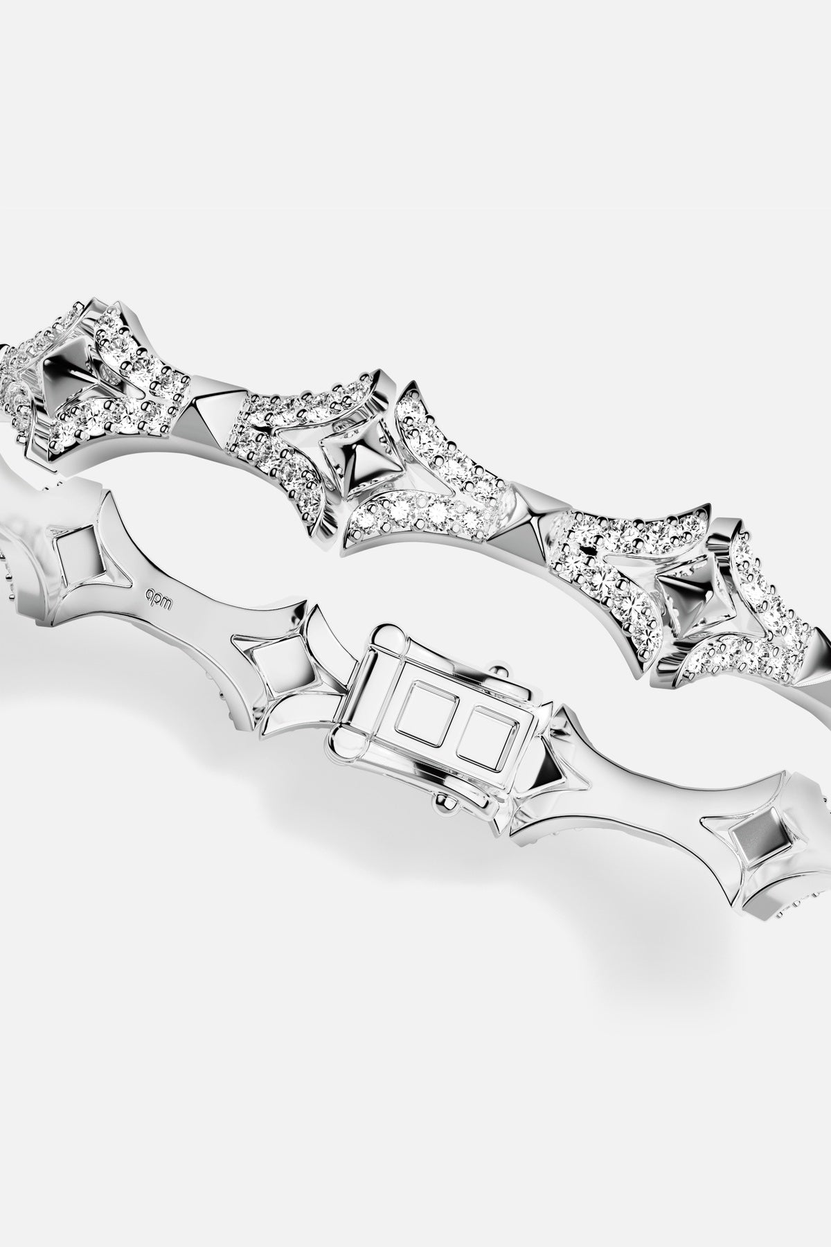 APM Bracelet in rhodium finish, sculpted edges and sparkling curves for bold elegance.