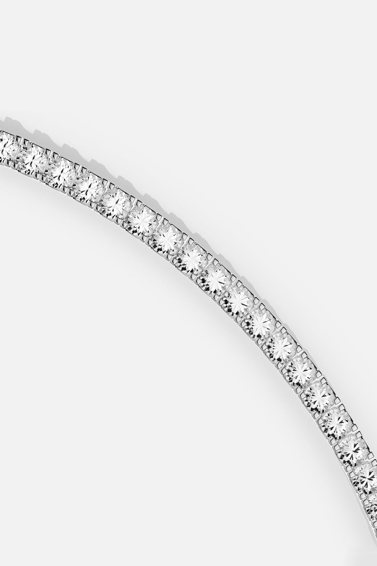 APM Tennis Bracelet in rhodium finish, a timeless line of quiet brilliance.