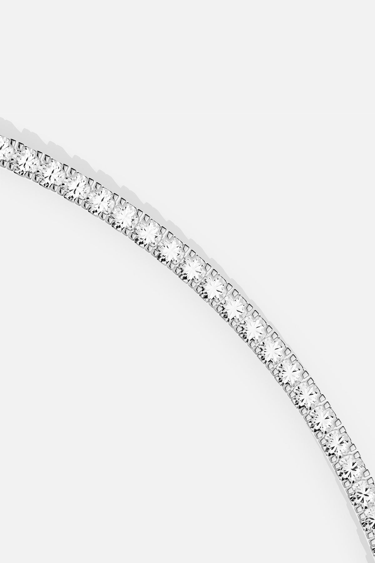 APM Tennis Necklace, a luminous line of brilliance in rhodium finish.