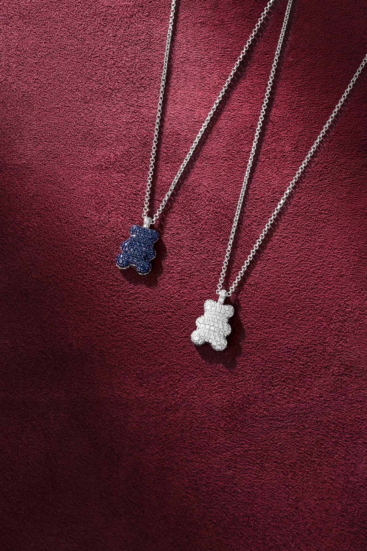APM bear pendant necklaces, playful sparkle in blue and white, effortlessly charming.