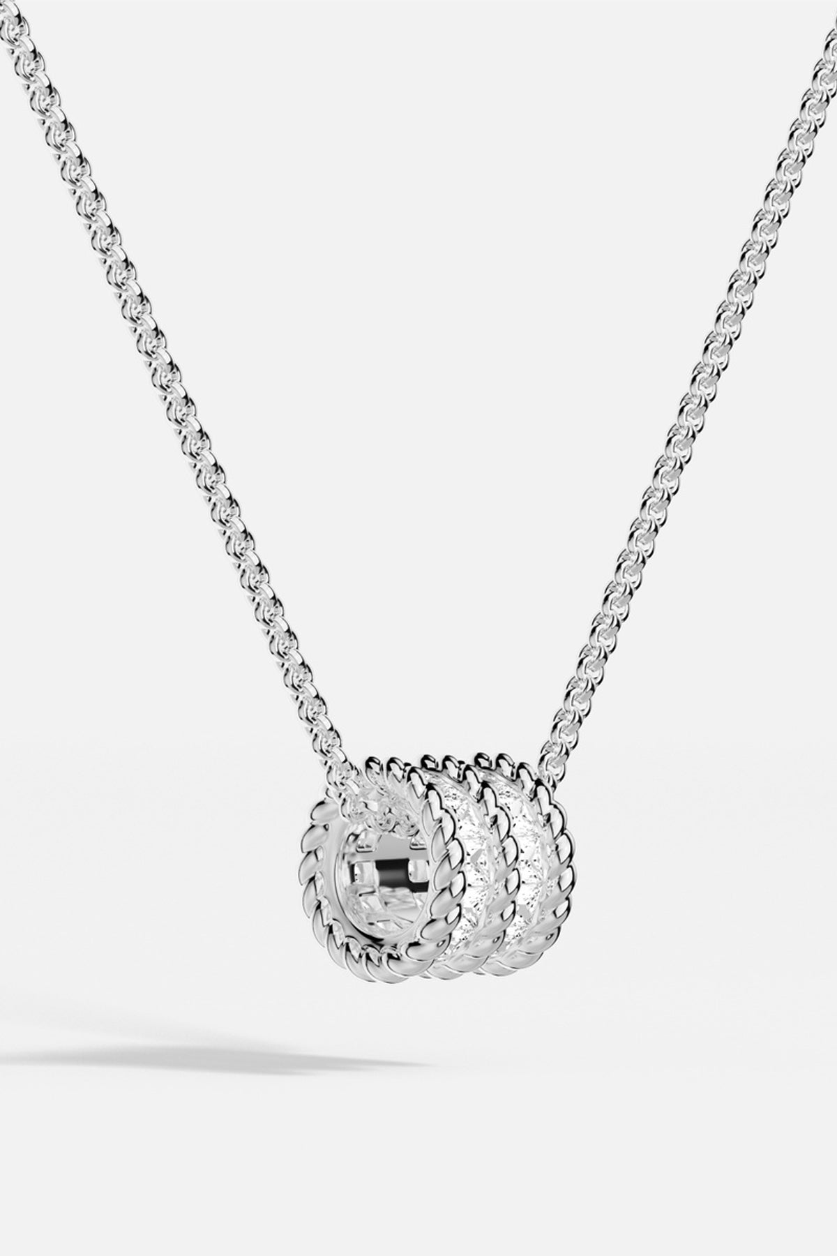 APM Necklace with a twisted rhodium finish pendant, effortlessly radiant and modern.
