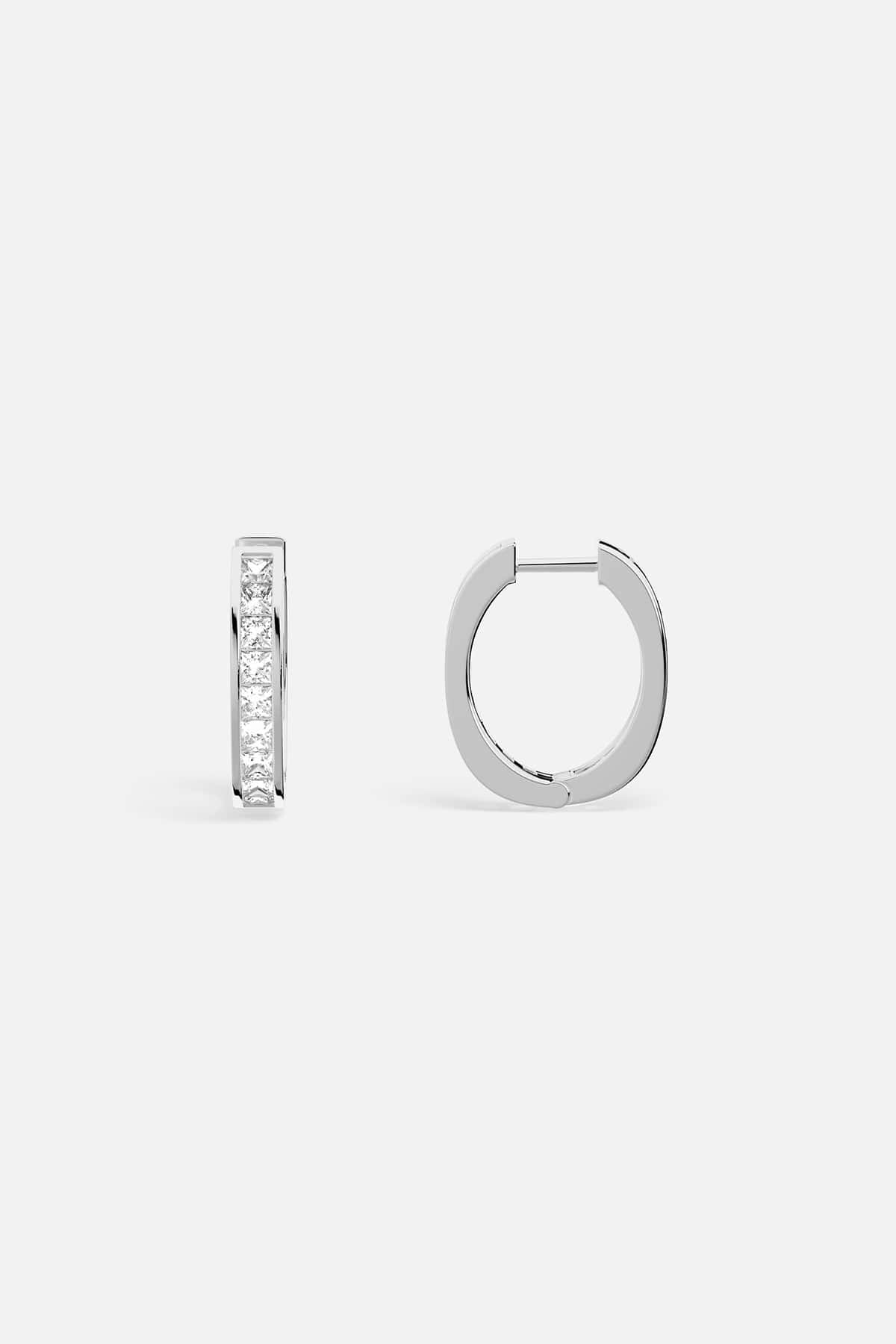 APM Hoop Earrings, a sleek rhodium finish with a quiet, radiant shimmer.