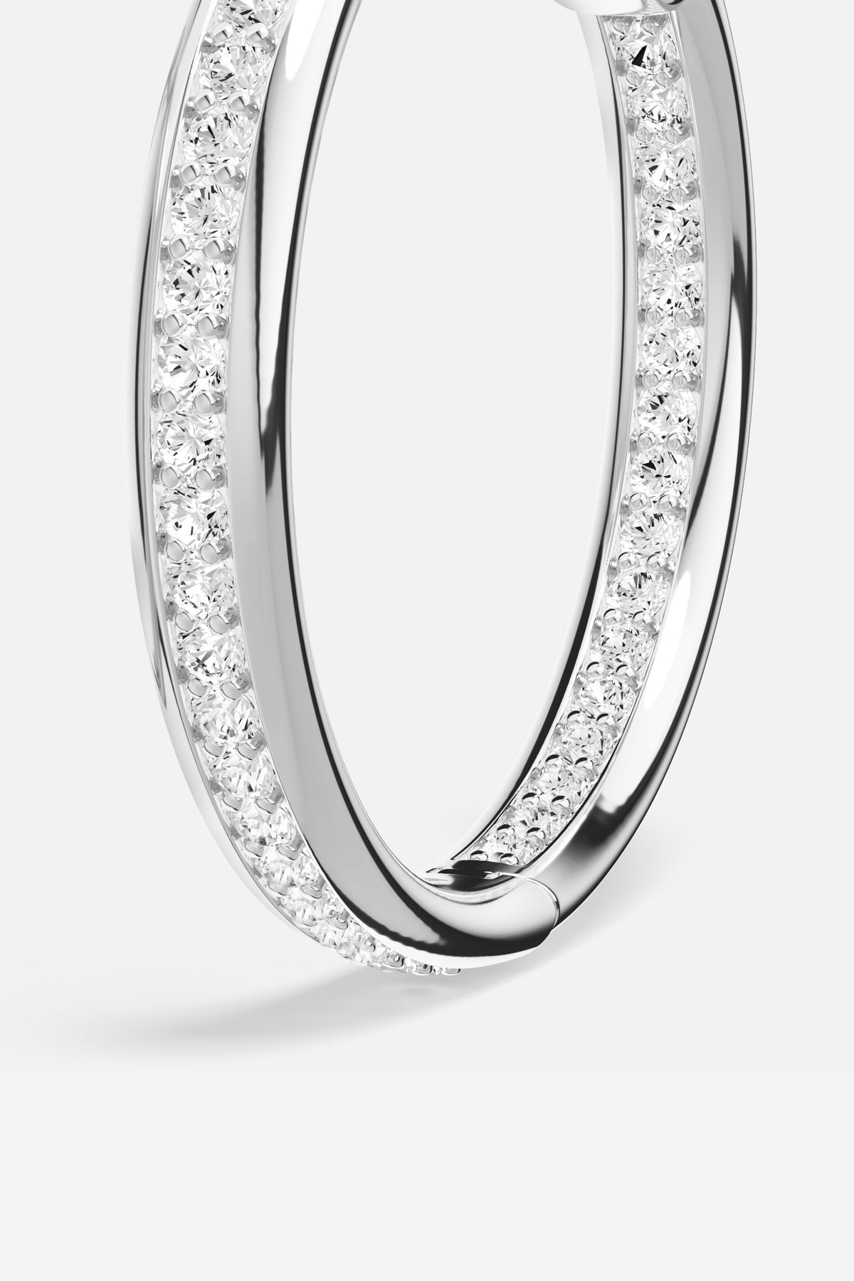 APM Hoop Earrings in rhodium finish, a timeless sparkle for effortless elegance.