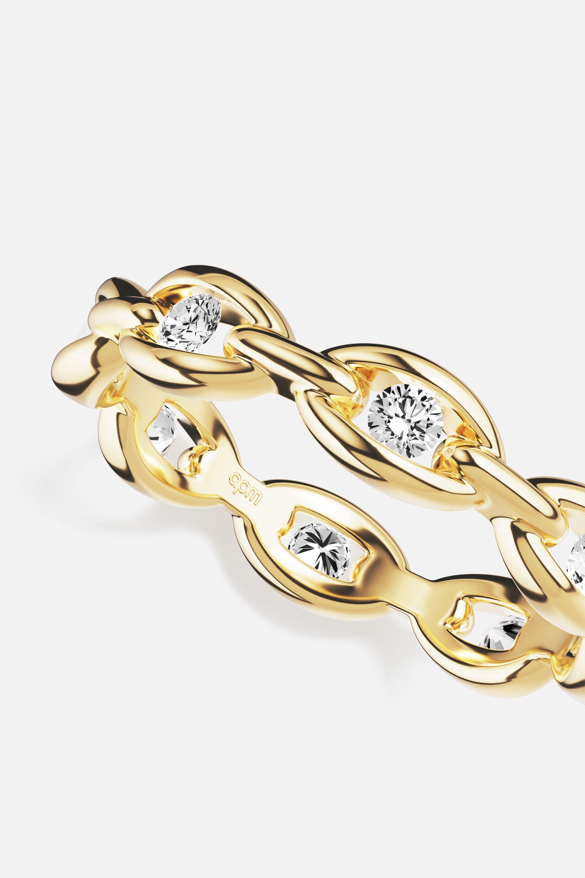 APM Chain Ring in golden color, luminous links with a modern radiance.
