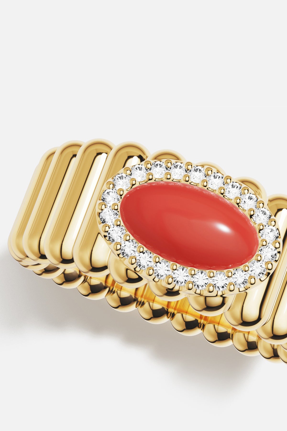 APM Ring in golden hue, a coral glow encircled in radiance, quietly bold.