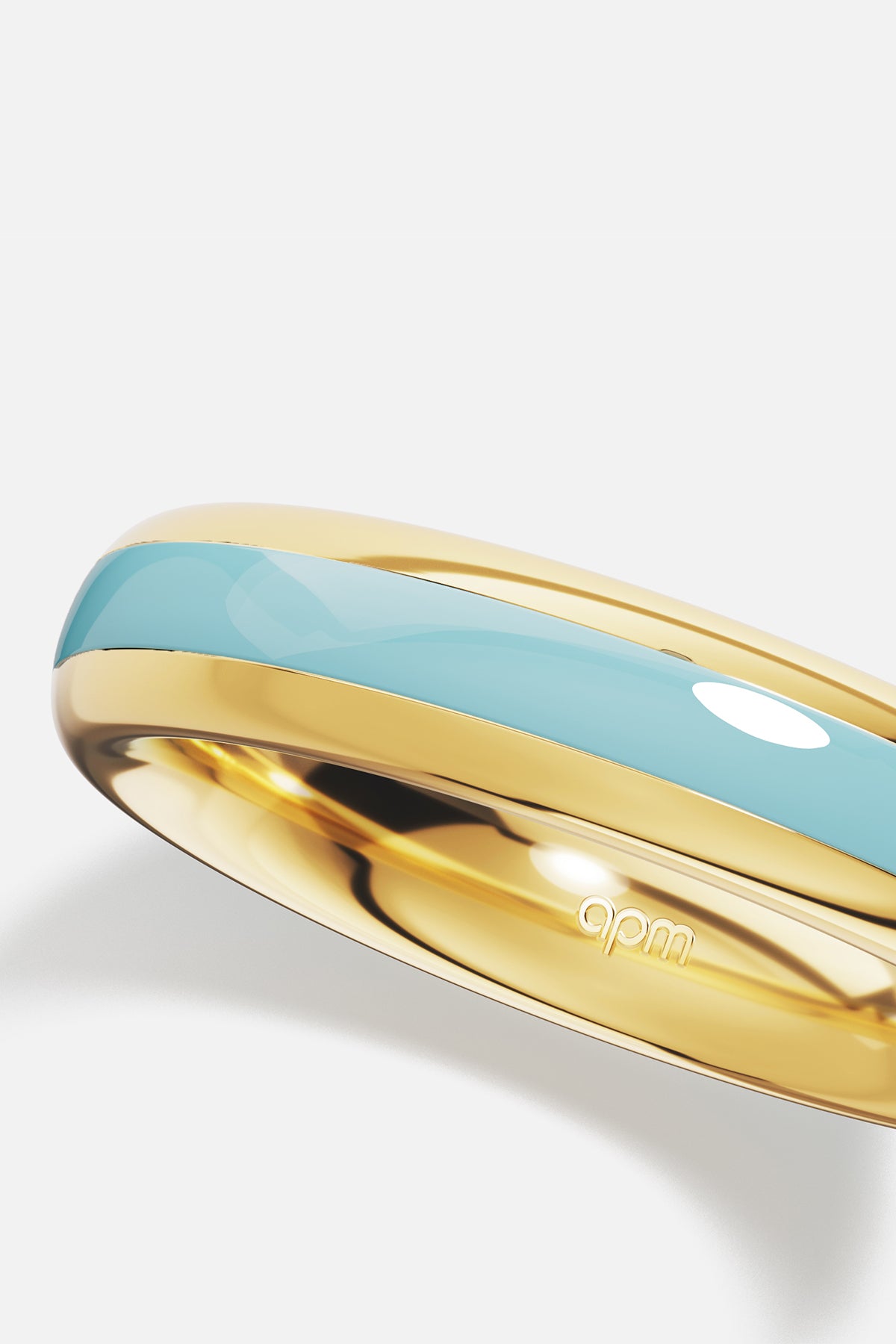 APM Ring in golden hues and soft turquoise, a breath of Riviera charm.