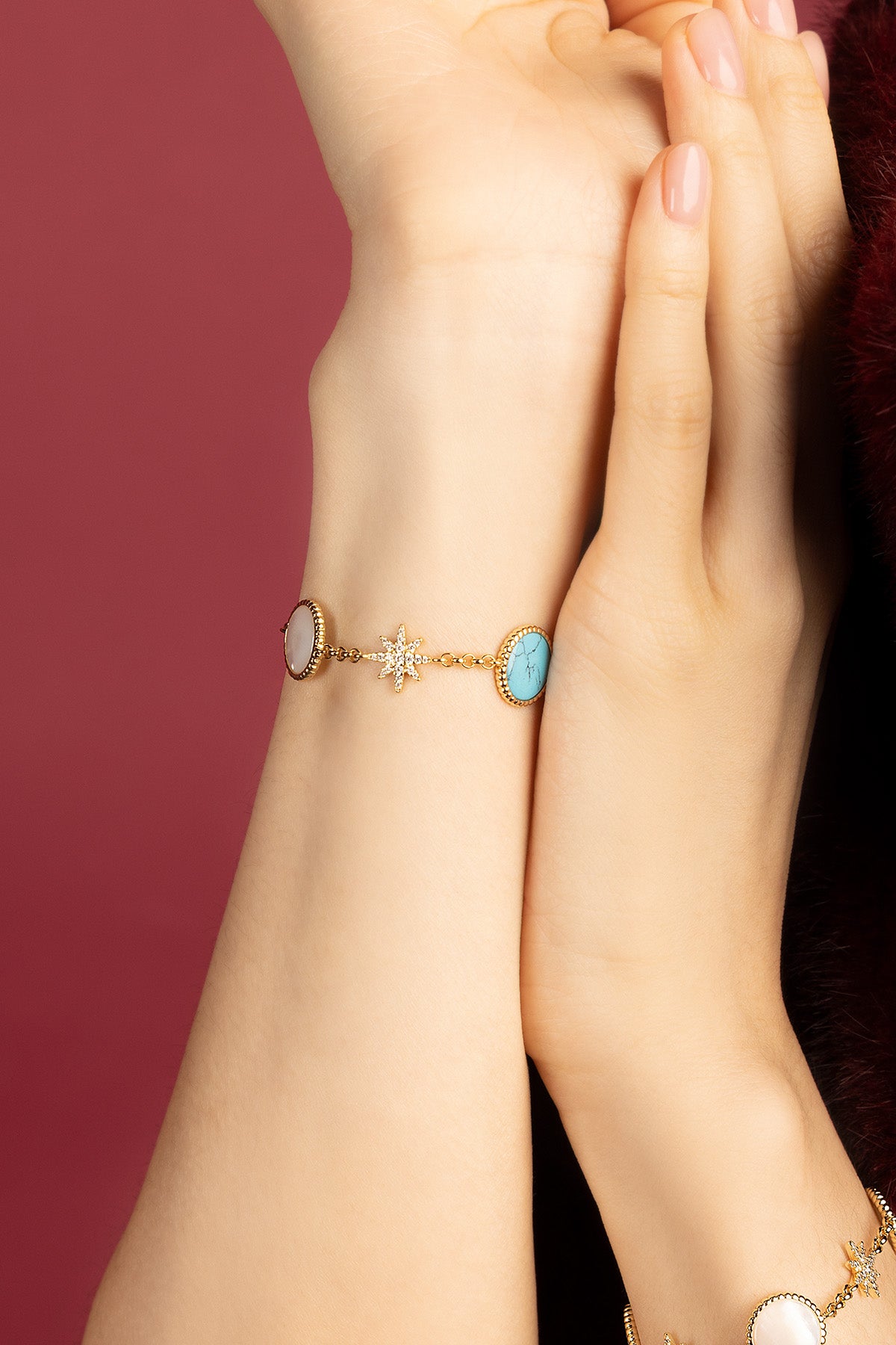 Woman wearing APM Météorites Bracelet, a celestial glow on the wrist.