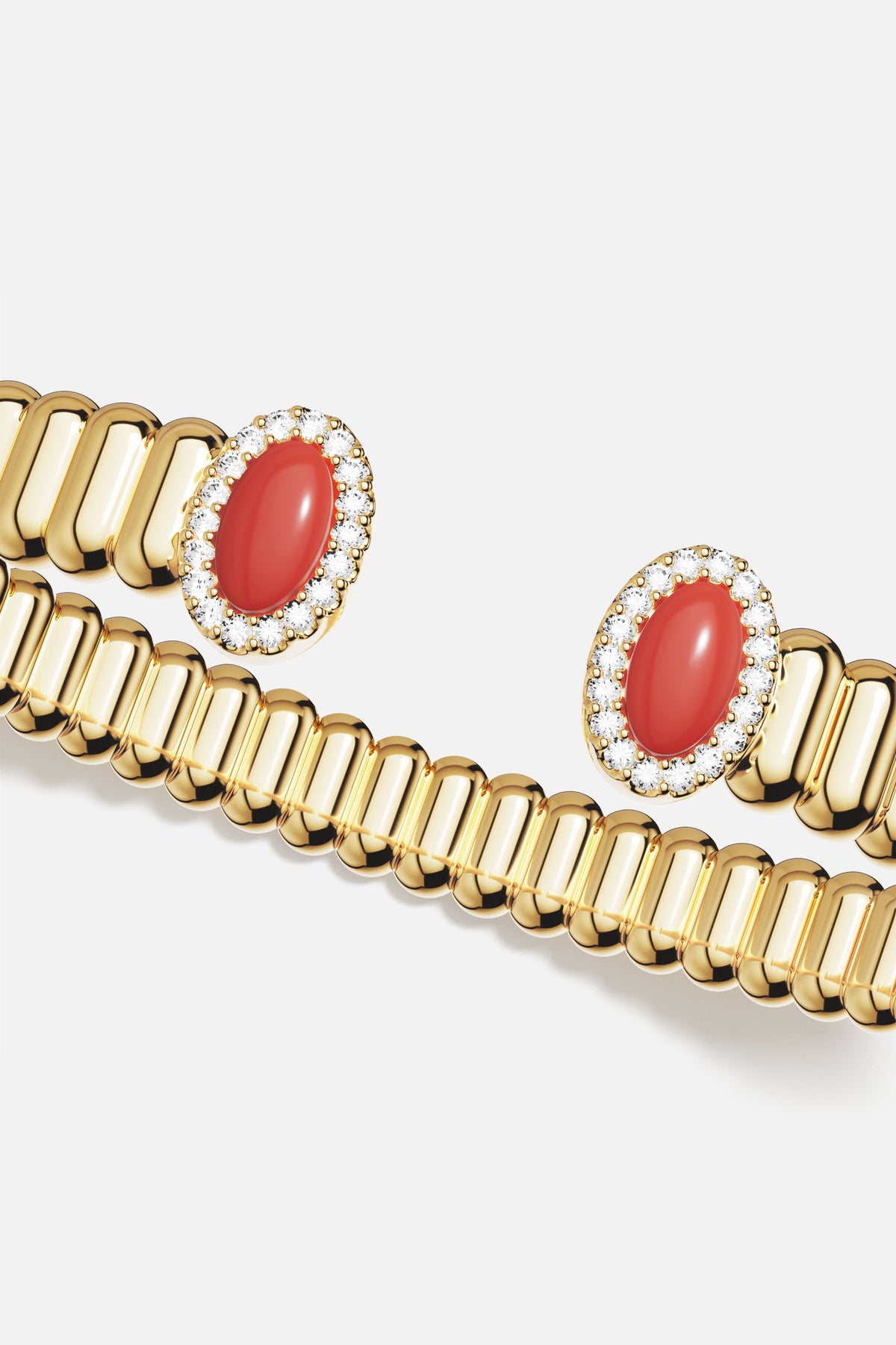 APM Monaco open bangle, golden glow with coral warmth, quietly radiant.