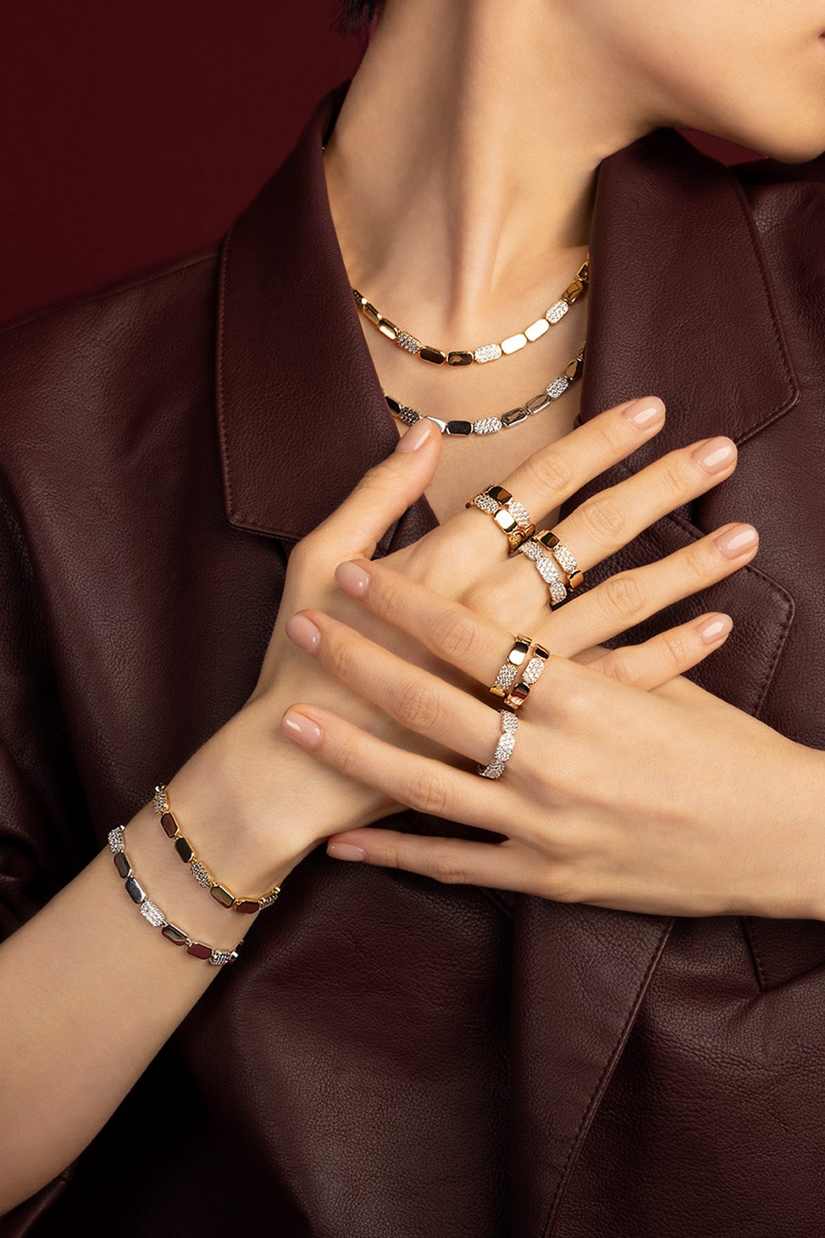 Woman wearing APM Morse jewelry set, bold golden allure with quiet modern confidence.