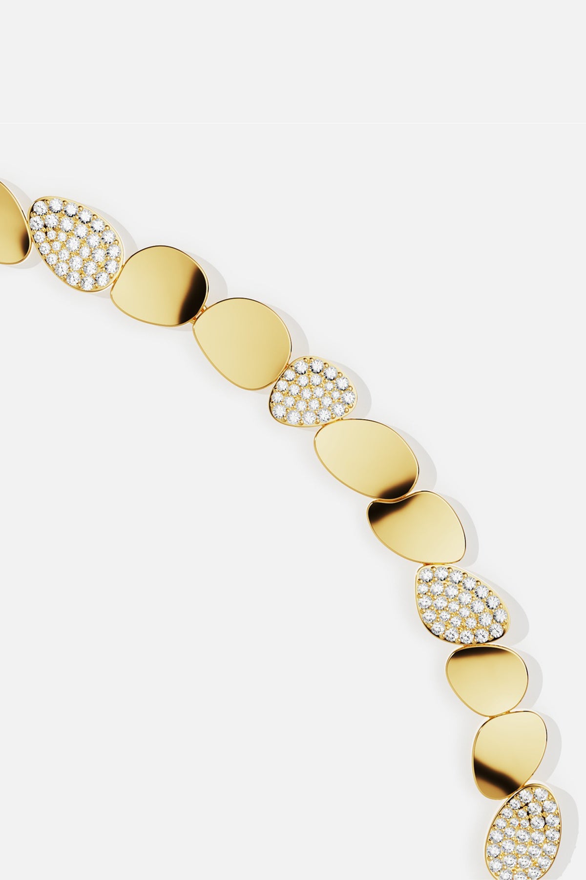 APM Monaco bracelet in golden pebbles, a luminous flow of modern elegance.