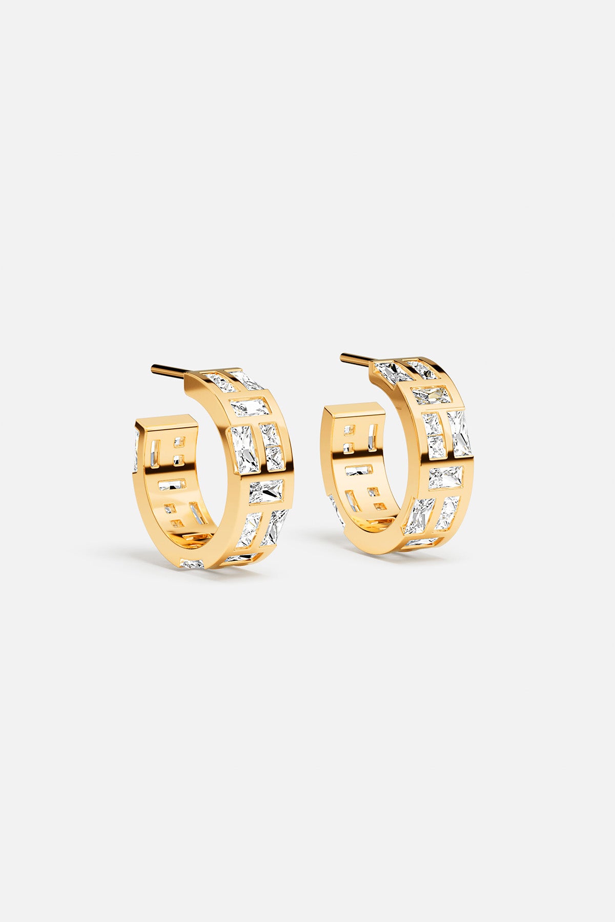 APM Hoop Earrings in golden color, bold brilliance with a modern edge.