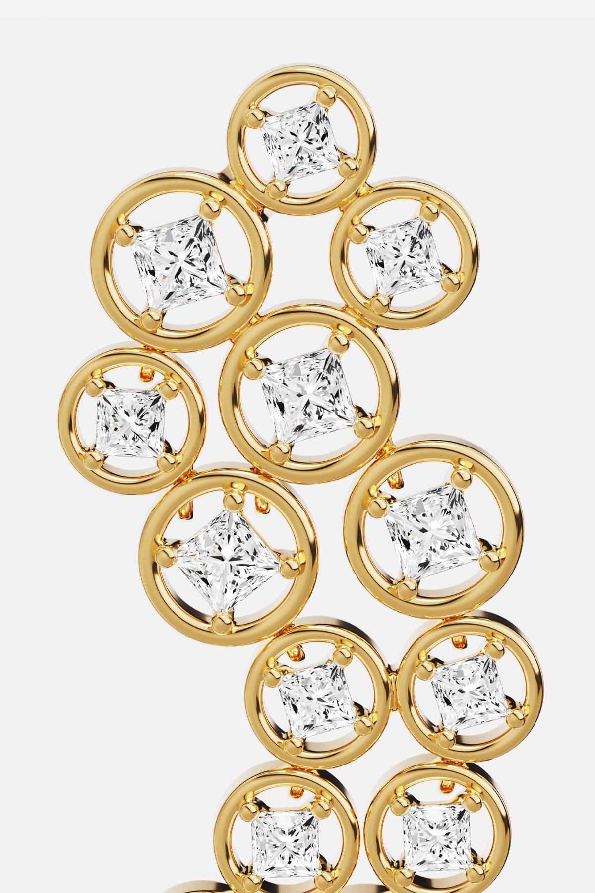 APM Earrings in golden rhodium finish, a cascade of luminous circles and sparkle.