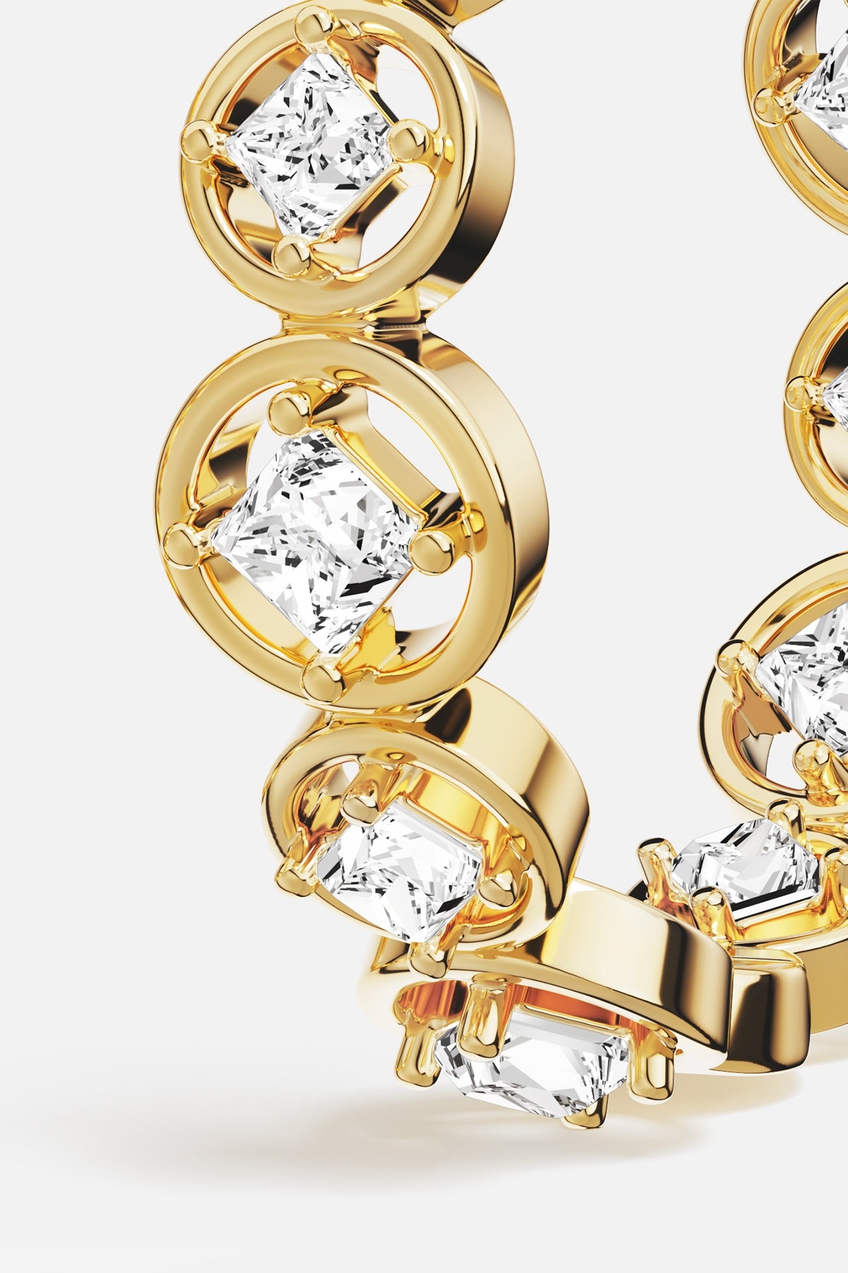 APM Ring in golden hues, luminous stones set in circular links, quietly radiant.